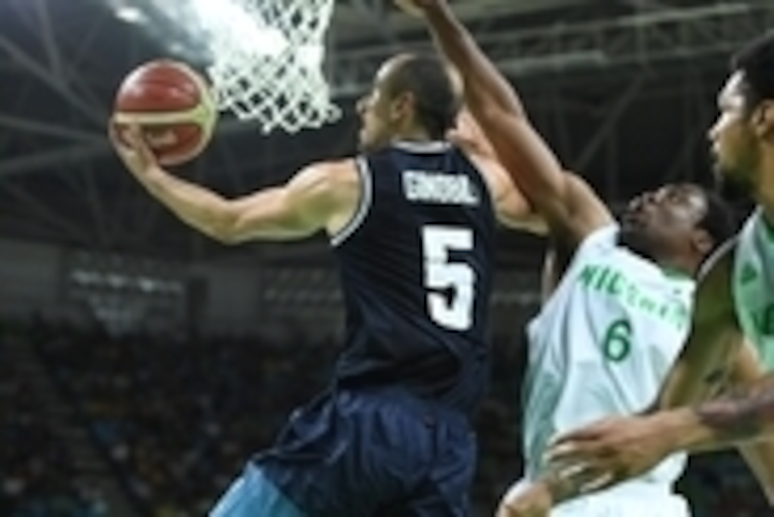 Aug 7, 2016; Rio de Janeiro, Brazil; Argentina shooting guard Manu Ginobili (5) lays up past Nigeria forward Ike Diogu (6) in a mens preliminary basketball game at Carioca Arena 1 during the Rio 2016 Summer Olympic Games. Mandatory Credit: Robert Hanashir