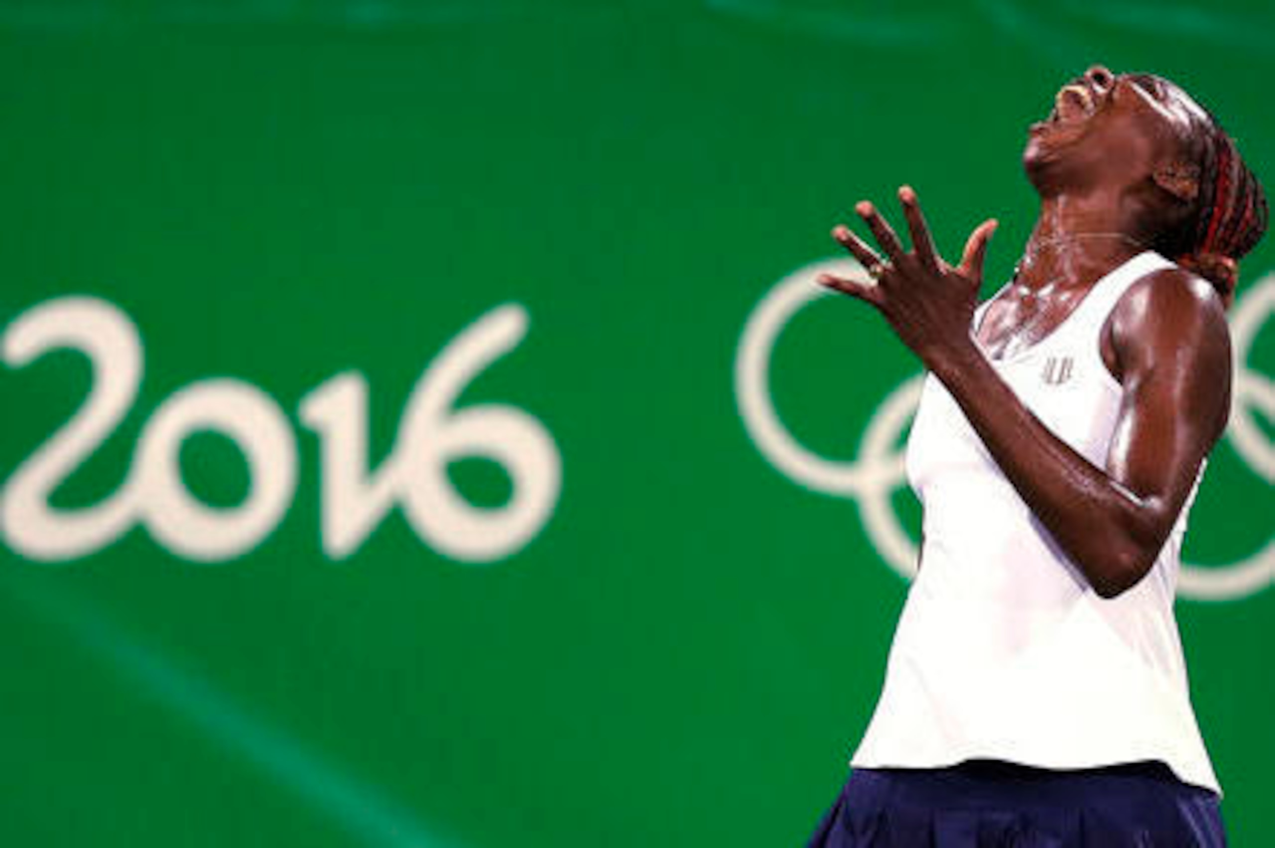 Venus Williams screams after making an unforced error during a first-round doubles match at the 2016 Olympics in Rio.