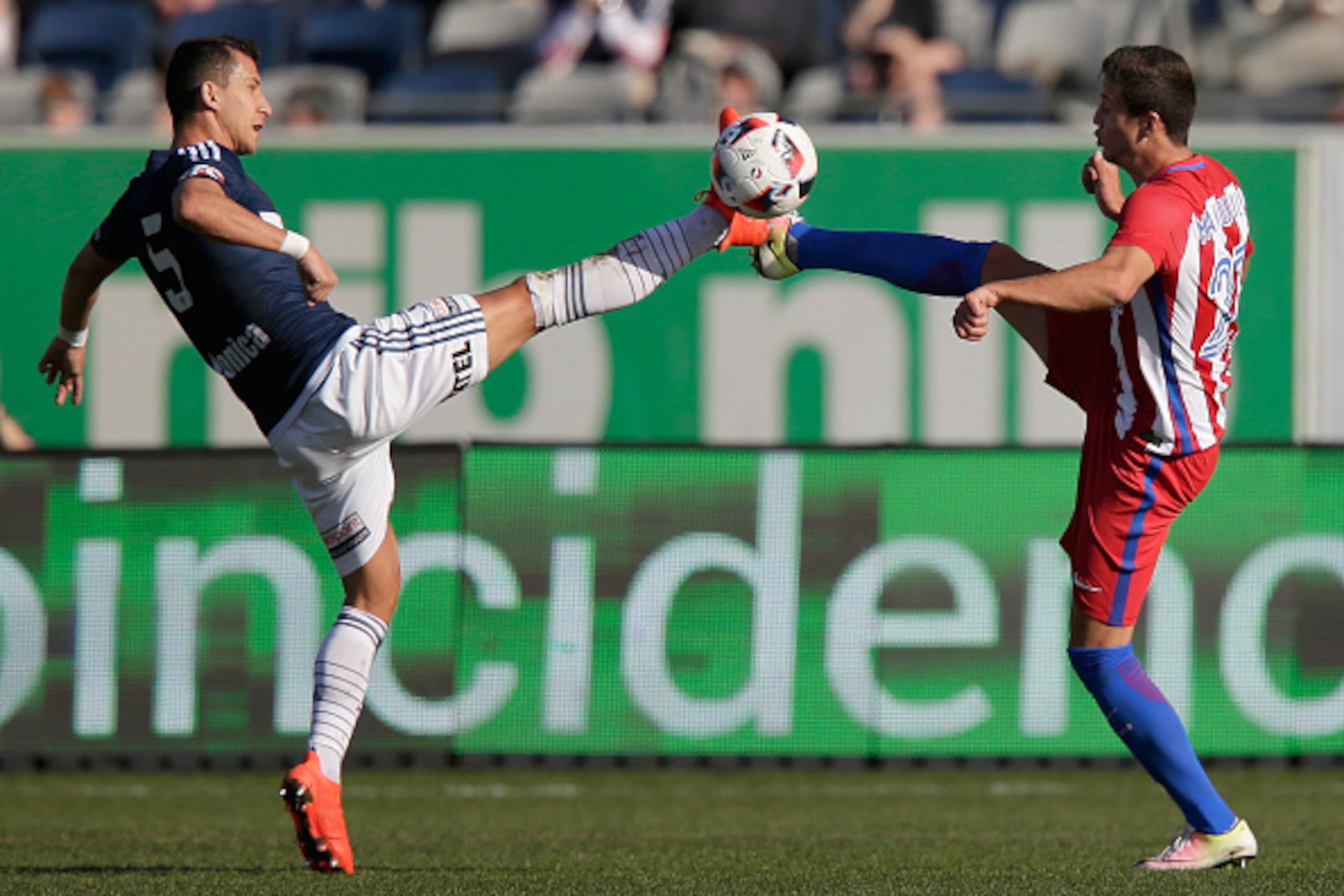 GEELONG, AUSTRALIA - JULY 31:  Daniel Georgievski of the Victory and Javier Manquillo of Atletico Madrid compete for the ball during the match between Melbourne Victory and Atletico de Madrid at Simonds Stadium on July 31, 2016 in Geelong, Australia.  (Ph