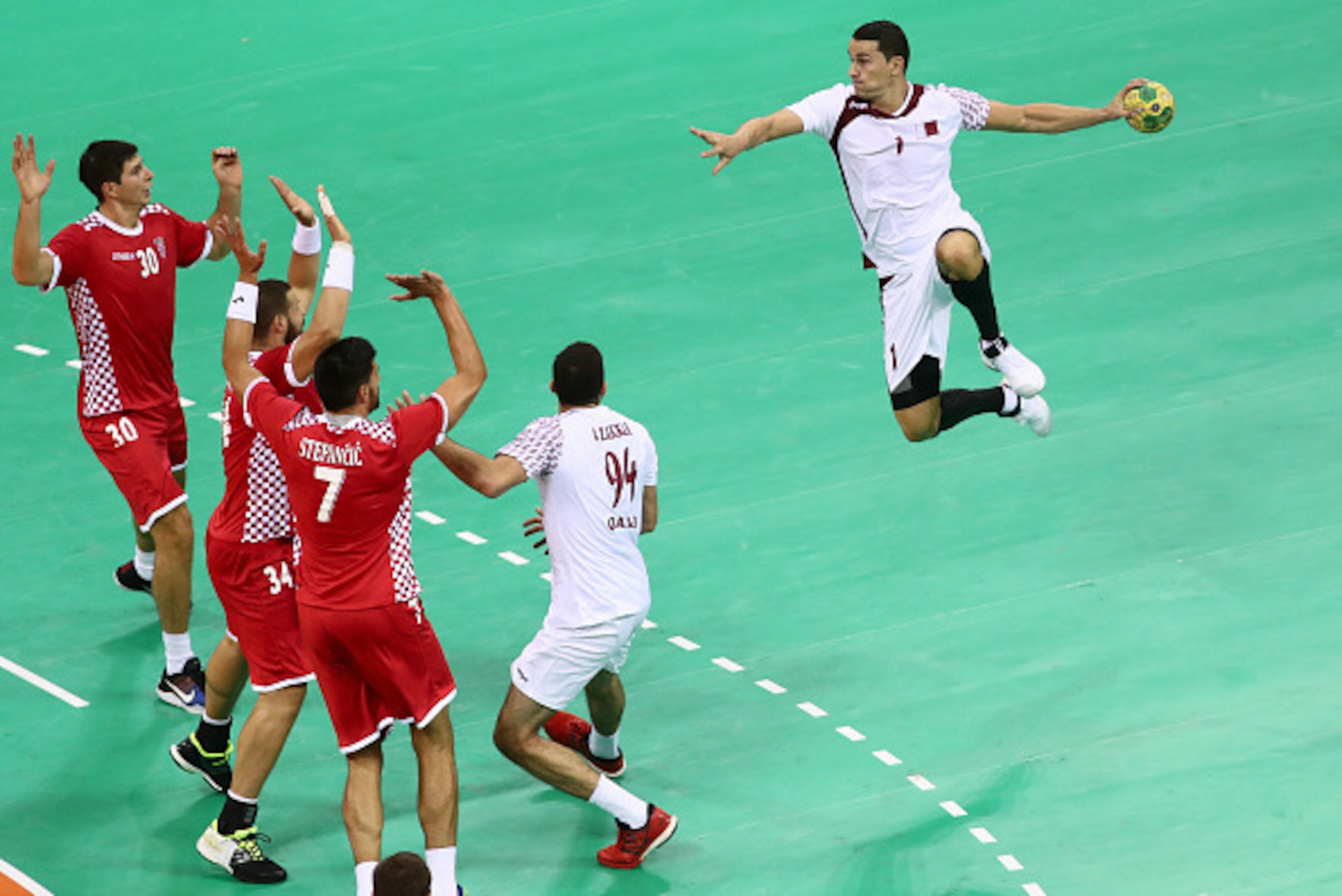 RIO DE JANEIRO, BRAZIL - AUGUST 07: Zarko Markovic of Qatar jumps to shoot at goal during the MenÂs Preliminary Group A match between Croatia and Qatar on Day 2 of the Rio 2016 Olympic G  (Photo by Phil Walter/Getty Images)