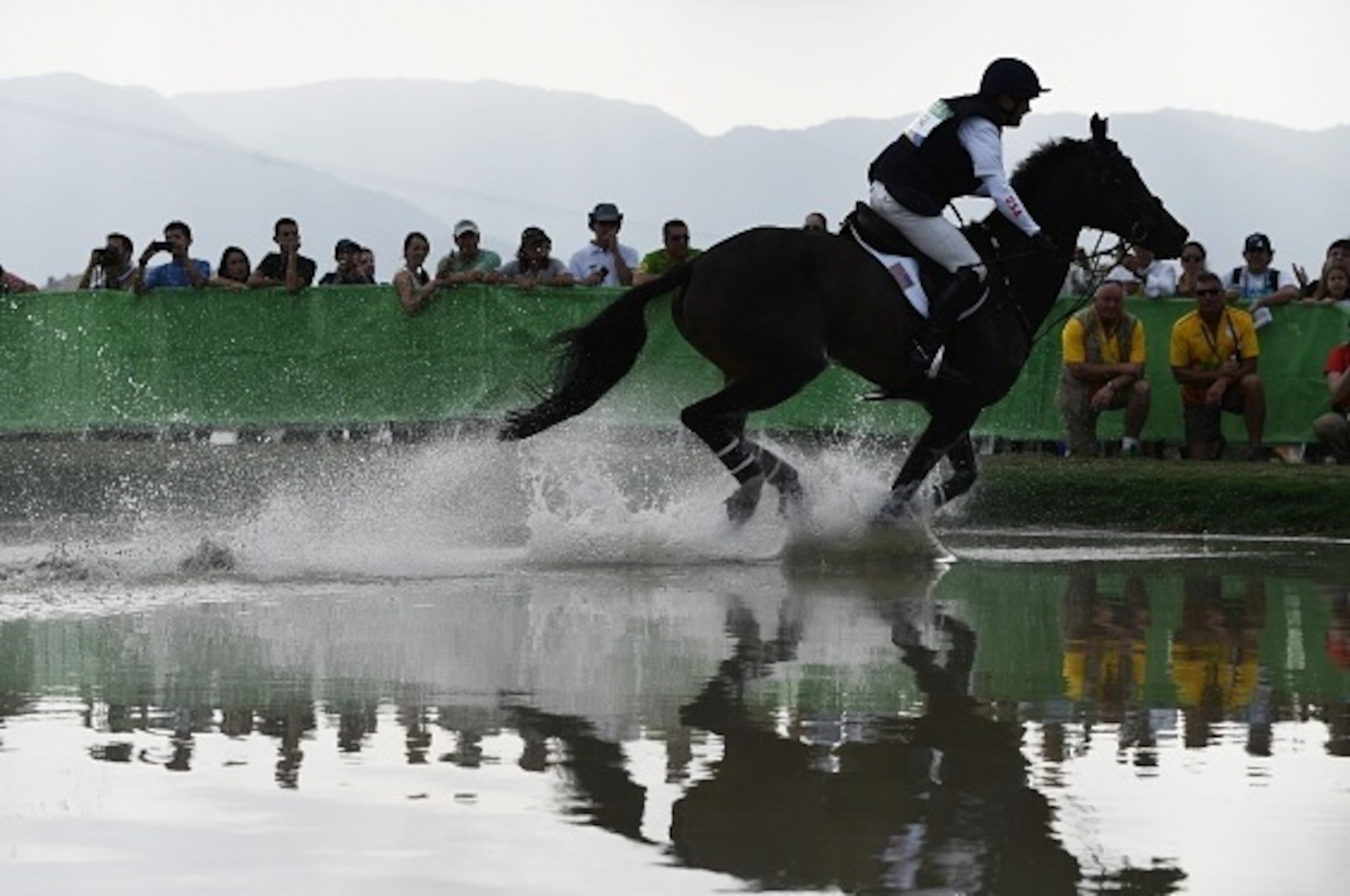 US rider Phillip Dutton on Mighty Nice competes in the Eventing's Individual Cross Country of the Equestrian during the 2016 Rio Olympic Games at the Olympic Equestrian Centre in Rio on August 8, 2016. / AFP / Ed JONES        (Photo credit should read ED 