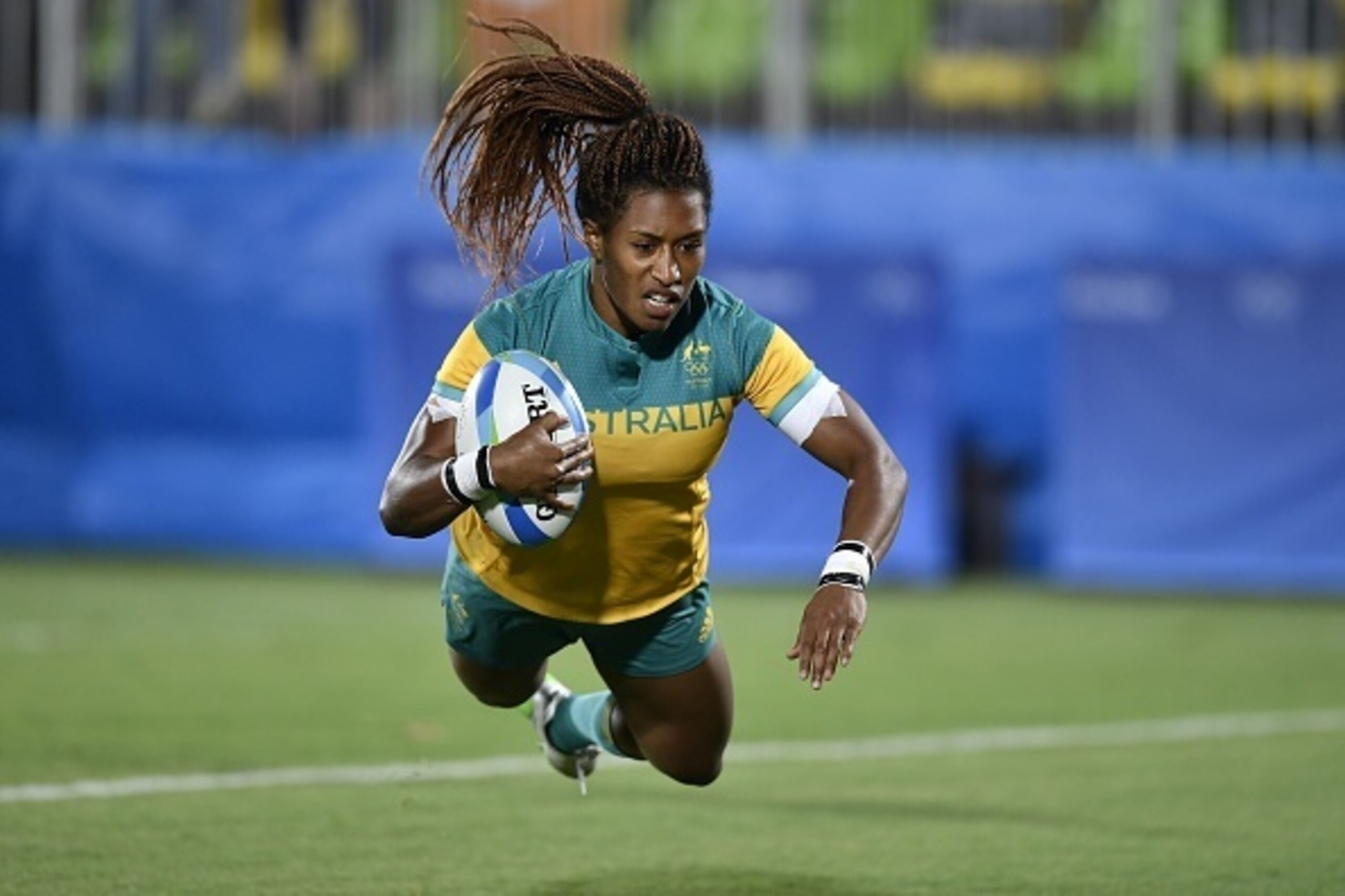 Australia's Ellia Green scores a try in the womens rugby sevens gold medal match between New Zealand and Australia during the Rio 2016 Olympic Games at Deodoro Stadium in Rio de Janeiro on August 8, 2016. / AFP / PHILIPPE LOPEZ (Photo credit should Australia's Ellia Green scores a try in the womens rugby sevens gold medal match between New Zealand and Australia during the Rio 2016 Olympic Games at Deodoro Stadium in Rio de Janeiro on August 8, 2016. / AFP / PHILIPPE LOPEZ (Photo credit should