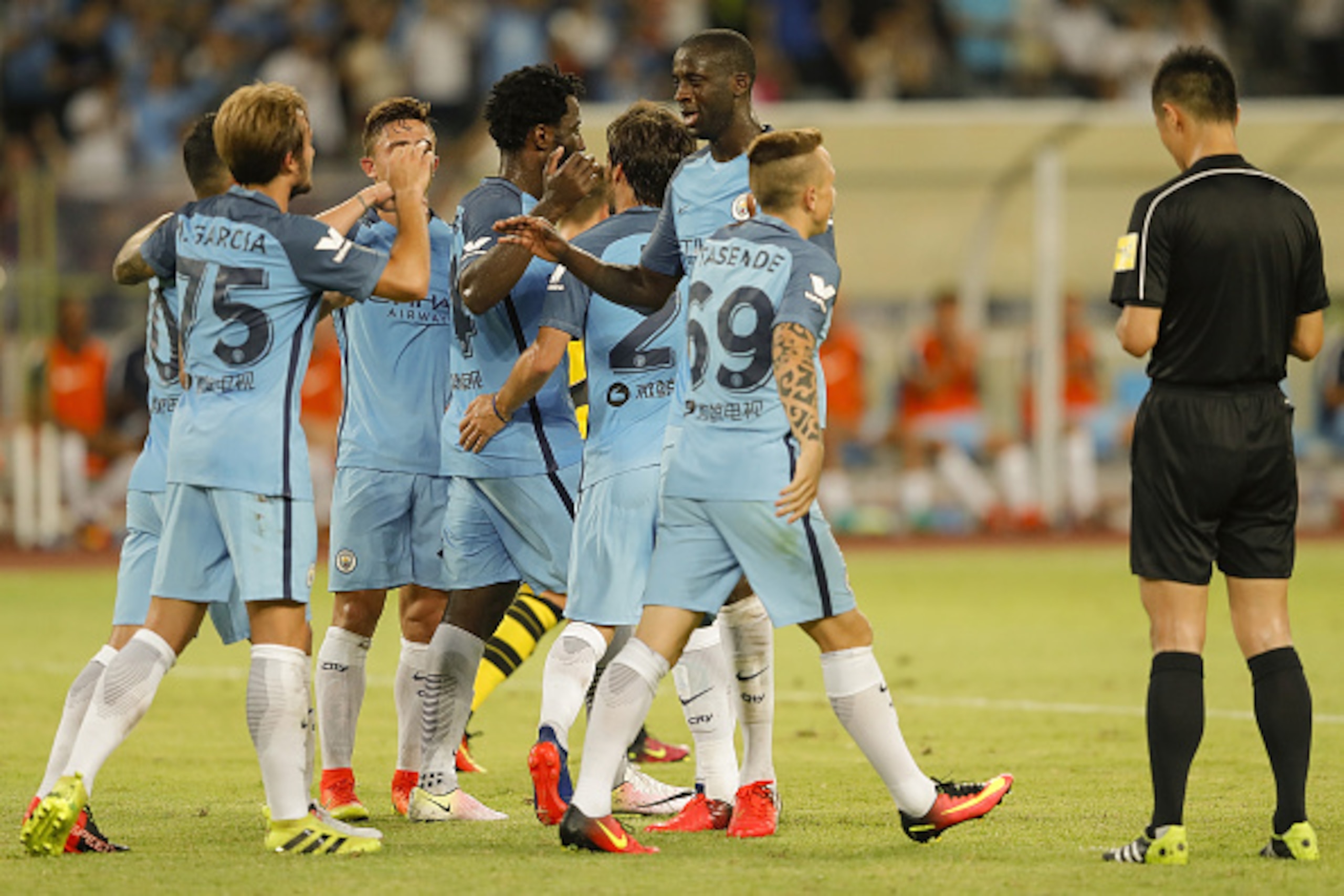SHENZHEN, CHINA - JULY 28:  Team of Manchester City celebrates after Sergio Aguero scores the first goal during the 2016 International Champions Cup match between Manchester City and Borussia Dortmund at Shenzhen Universiade Stadium on July 28, 2016 in Sh