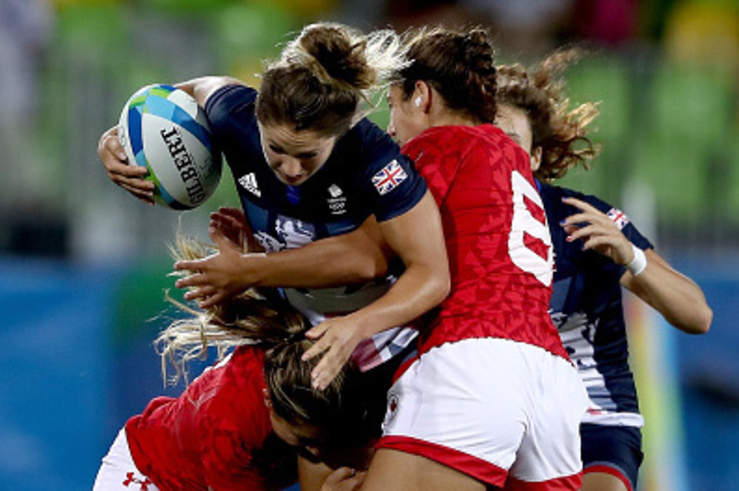 RIO DE JANEIRO, BRAZIL - AUGUST 08: Bianca Farella of Canada tackles Amy Wilson Hardy of Great Britain during the Women's Bronze Medal Rugby Sevens match between Canada and Great Britain on Day 3 of the Rio 2016 Olympic Games at the Deodoro Stadium on Aug