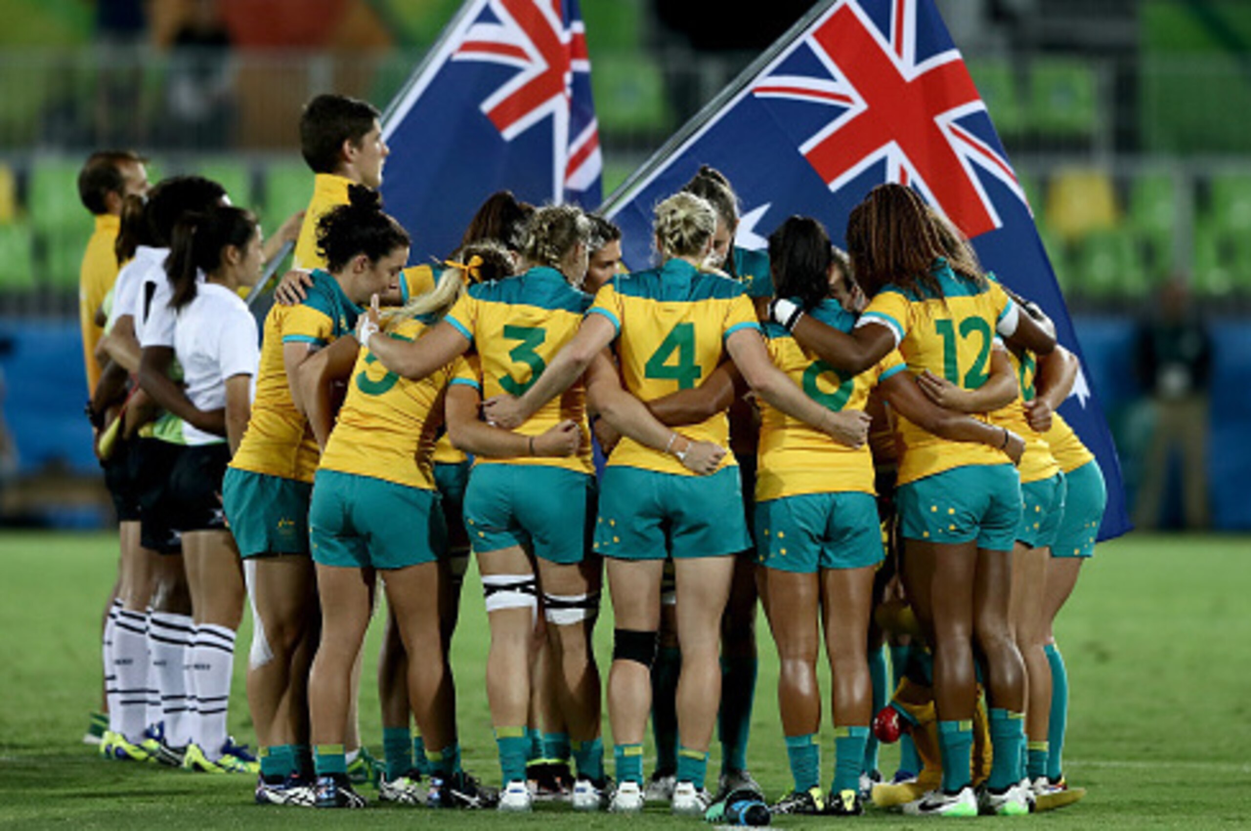 RIO DE JANEIRO, BRAZIL - AUGUST 08:  Team Australia huddles ahead of the Women's Gold Medal Rugby Sevens match between Australia and New Zealand on Day 3 of the Rio 2016 Olympic Games at the Deodoro Stadium on August 8, 2016 in Rio de Janeiro, Brazil.  (P