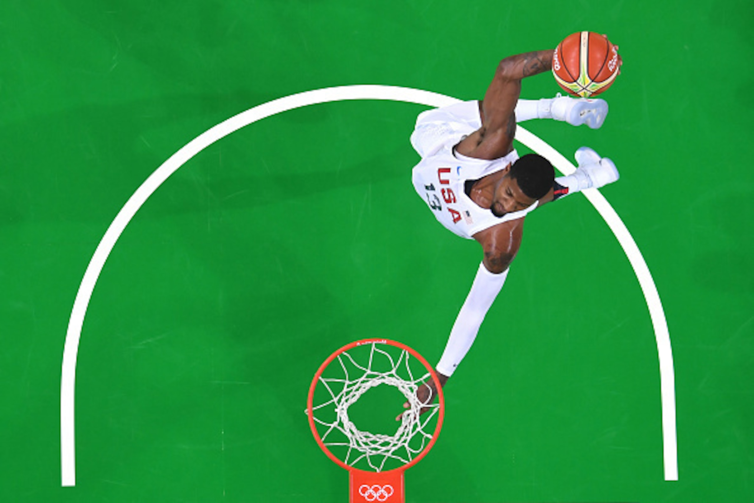 An overview shows USA's guard Paul George slam dunking during a Men's round Group A basketball match between USA and Venezuela at the Carioca Arena 1 in Rio de Janeiro on August 8, 2016 during the Rio 2016 Olympic Games. / AFP / Andrej ISAKOVIC        (Ph