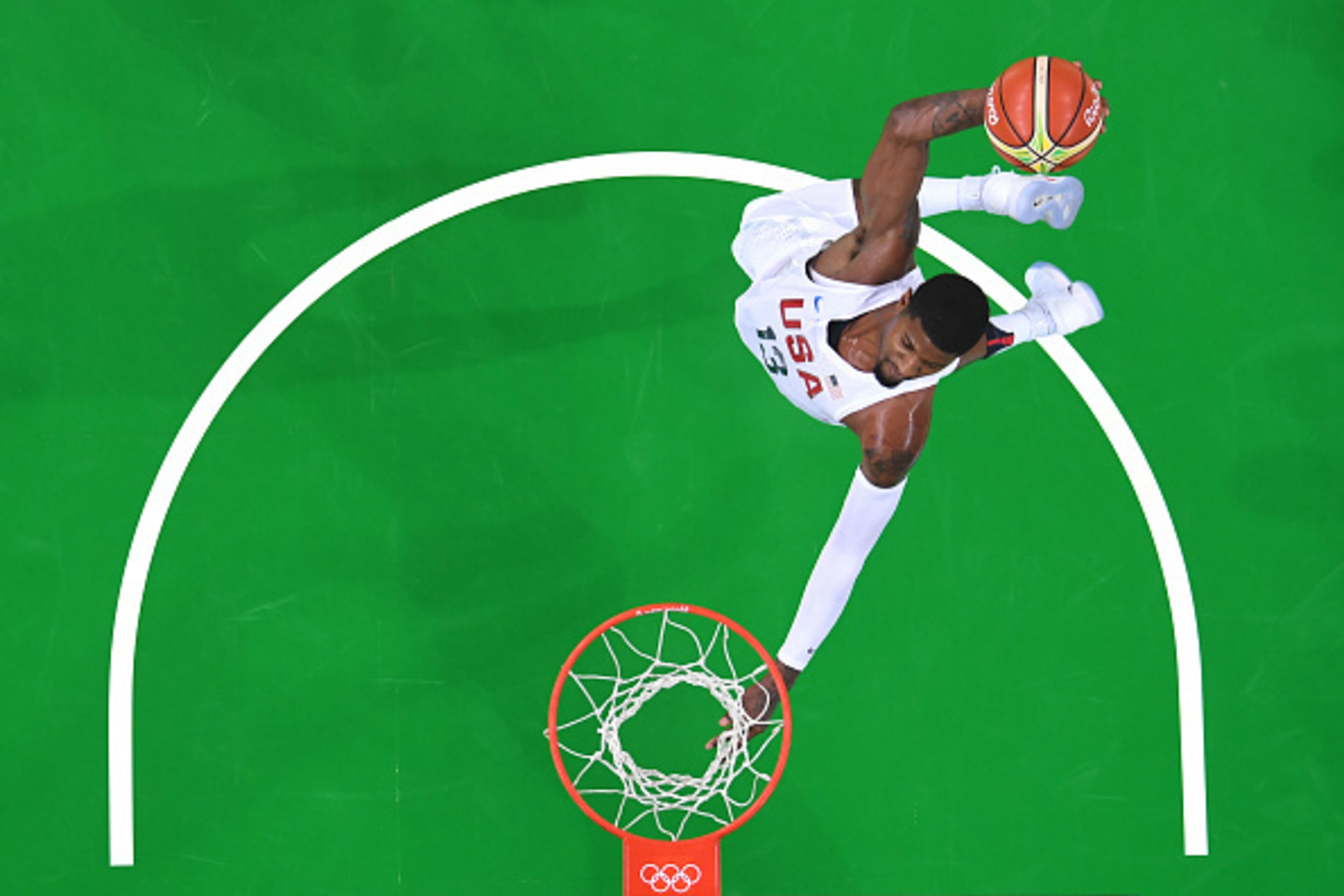 An overview shows USA's guard Paul George slam dunking during a Men's round Group A basketball match between USA and Venezuela at the Carioca Arena 1 in Rio de Janeiro on August 8, 2016 during the Rio 2016 Olympic Games. / AFP / Andrej ISAKOVIC        (Ph