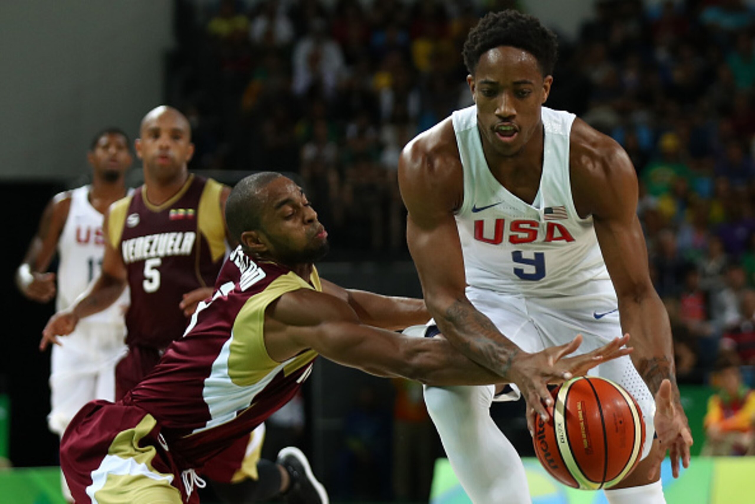 RIO DE JANEIRO, BRAZIL - AUGUST 08:  Demar DeRozan #9 of United States drives the ball against David Cubillan #8 of Venezuela in the men's preliminary round group A game 19  on Day 3 of the Rio 2016 Olympic Games at the Carioca Arena 1 on August 8, 2016 i