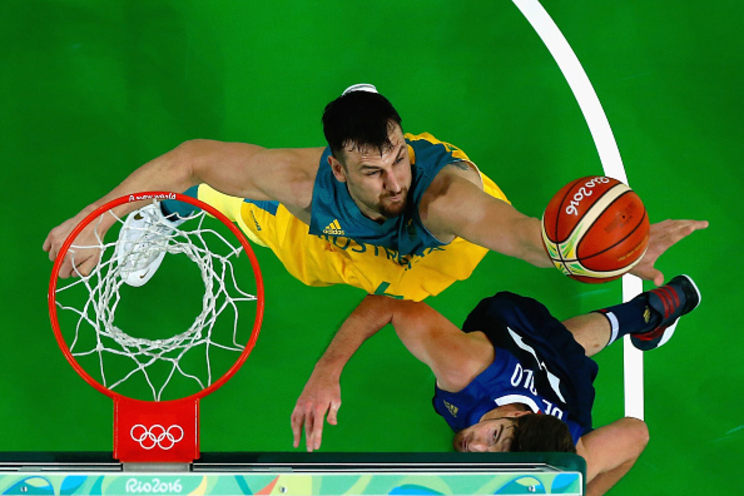 RIO DE JANEIRO, BRAZIL - AUGUST 06:  Andrew Bogut #6 of Australia battles for the ball against Nando de Colo #12 of France in the Men's Preliminary Round Group A match on Day 1 of the Rio 2016 Olympic Games at Carioca Arena 1 on August 6, 2016 in Rio de J