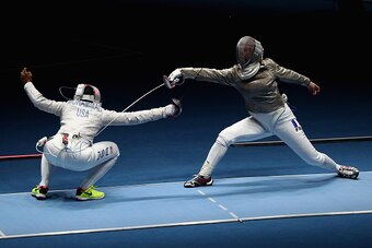 RIO DE JANEIRO, BRAZIL - AUGUST 08:  Ibtihaj Muhammad of the United States (L) competes against Cecilia Berder of France during the Women's Individual Sabre on Day 3 of the Rio 2016 Olympic Games at Carioca Arena 3 on August 8, 2016 in Rio de Janeiro, Bra