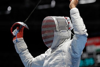 Muhammad celebrates during her opening match against Olena Kravatska of Ukraine.