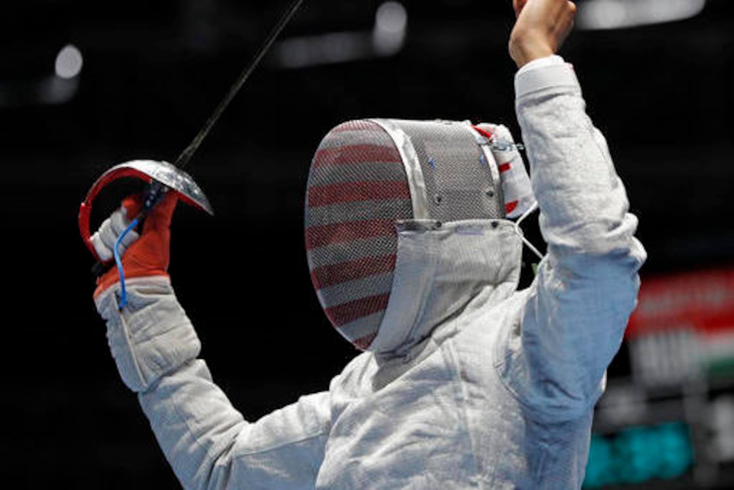 Muhammad celebrates during her opening match against Olena Kravatska of Ukraine.