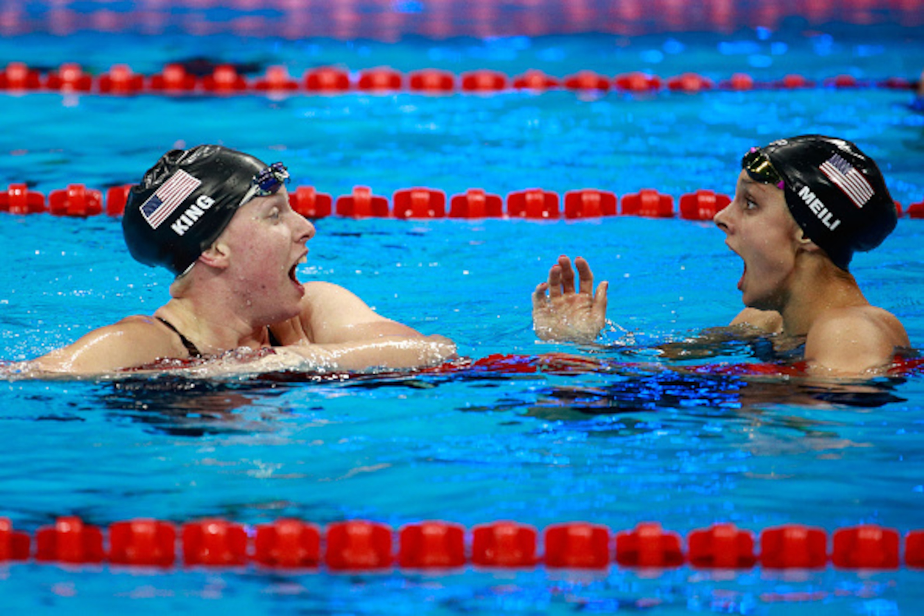 RIO DE JANEIRO, BRAZIL - AUGUST 08: Lilly King of the United States celebrates winning gold with Katie Meili of the United States in the Women's 100m Breaststroke Final on Day 3 of the Rio 2016 Olympic Games at the Olympic Aquatics Stadium on August 8, 2 RIO DE JANEIRO, BRAZIL - AUGUST 08: Lilly King of the United States celebrates winning gold with Katie Meili of the United States in the Women's 100m Breaststroke Final on Day 3 of the Rio 2016 Olympic Games at the Olympic Aquatics Stadium on August 8, 2