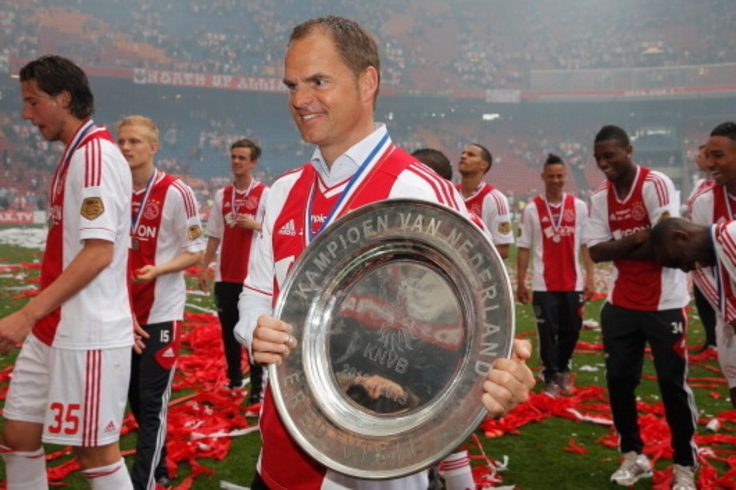 AMSTERDAM, NETHERLANDS - MAY 05:  Ajax Coach / Manager, Frank de Boer poses with the Eredivisie Championship trophy after the match between Ajax and Willem II Tilburg at Amsterdam Arena on May 5, 2013 in Amsterdam, Netherlands.  (Photo by Dean Mouhtaropou