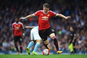 MANCHESTER, ENGLAND - MARCH 20:  Bastian Schweinsteiger of Manchester United evades Sergio Aguero of Manchester City during the Barclays Premier League match between Manchester City and Manchester United at Etihad Stadium on March 20, 2016 in Manchester, 
