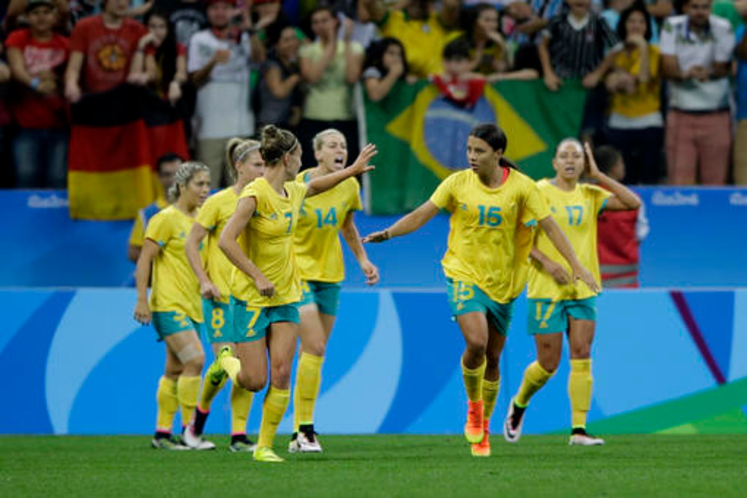 The Matildas celebrate scoring against Germany.