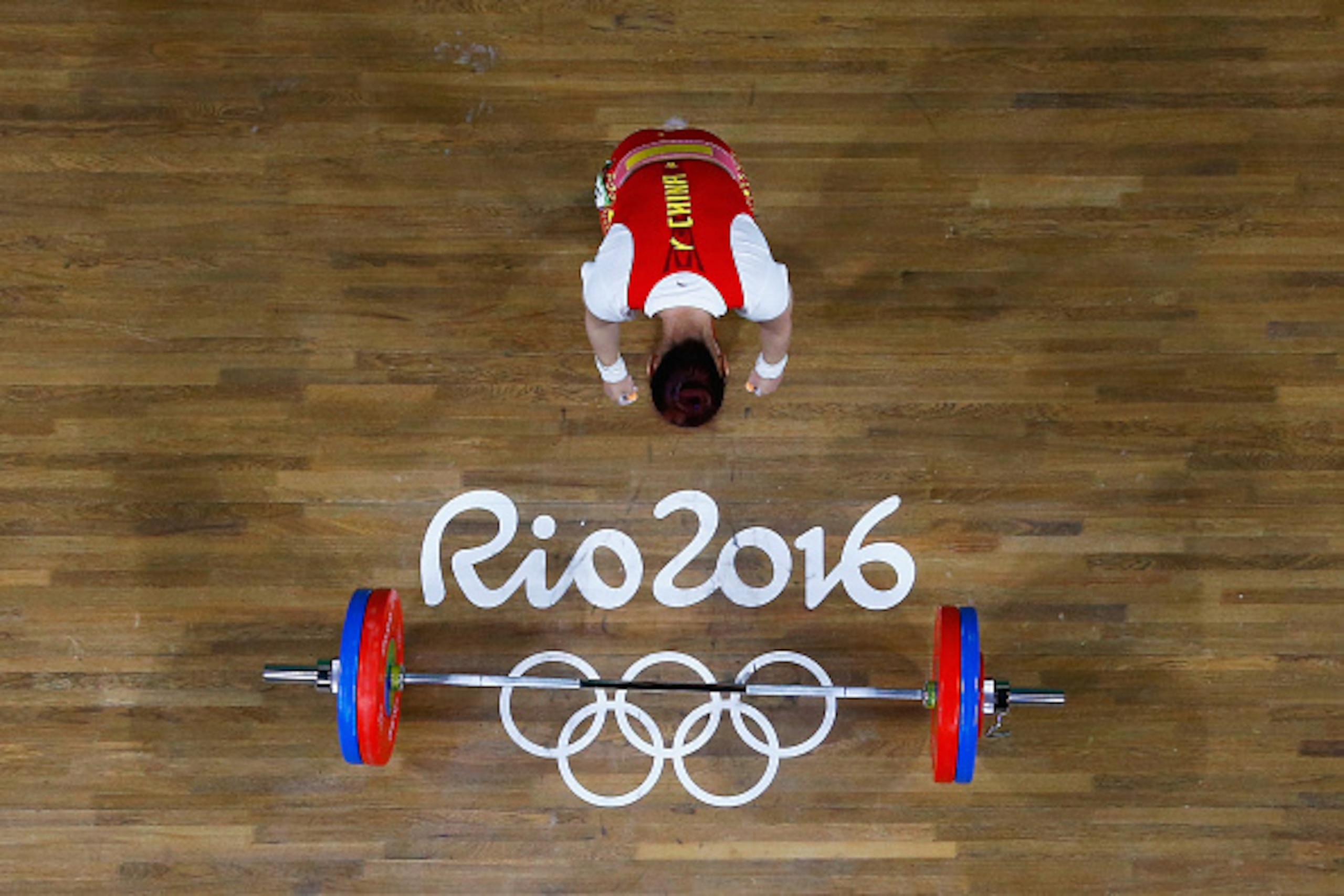 RIO DE JANEIRO, BRAZIL - AUGUST 09: Wei Deng of China competes during the Women's 63kg Group A Weightlifting contest on Day 4 of the Rio 2016 Olympic Games at the Riocentro - Pavilion 2 on August 9, 2016 in Rio de Janeiro, Brazil. (Photo by Pool/Getty I RIO DE JANEIRO, BRAZIL - AUGUST 09: Wei Deng of China competes during the Women's 63kg Group A Weightlifting contest on Day 4 of the Rio 2016 Olympic Games at the Riocentro - Pavilion 2 on August 9, 2016 in Rio de Janeiro, Brazil. (Photo by Pool/Getty I