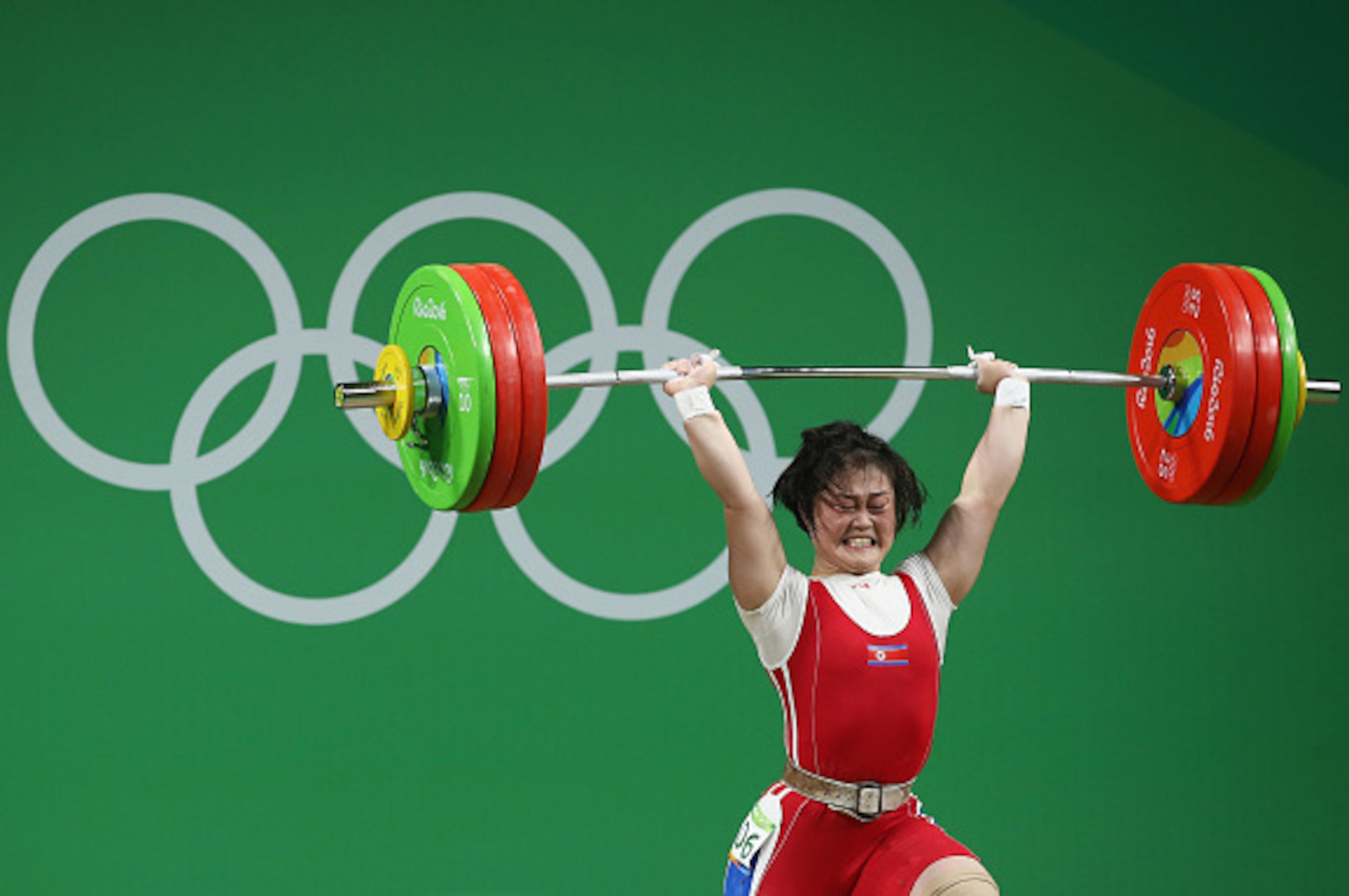 RIO DE JANEIRO, BRAZIL - AUGUST 09: Hyo Sim Choe of Korea lifts for an Olympic record during the Women's 63kg Group A Weightlifting contest on Day 4 of the Rio 2016 Olympic Games at the Riocentro - Pavilion 2 on August 9, 2016 in Rio de Janeiro, Brazil. RIO DE JANEIRO, BRAZIL - AUGUST 09: Hyo Sim Choe of Korea lifts for an Olympic record during the Women's 63kg Group A Weightlifting contest on Day 4 of the Rio 2016 Olympic Games at the Riocentro - Pavilion 2 on August 9, 2016 in Rio de Janeiro, Brazil.