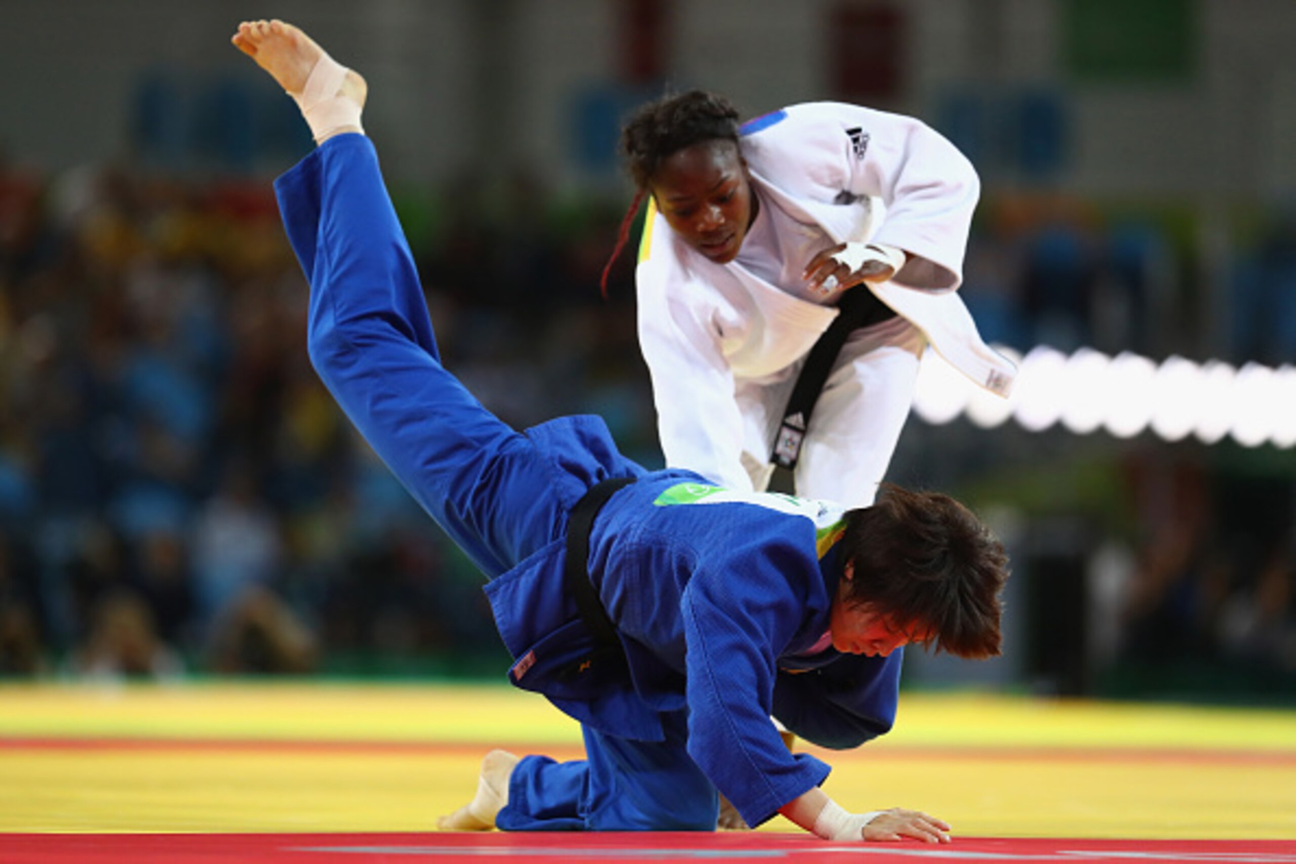 RIO DE JANEIRO, BRAZIL - AUGUST 09:  Clarisse Agbegnenou of France and Miku Tashiro of Japan compete during the Women's -63kg semifinal bout on Day 4 of the Rio 2016 Olympic Games at the Carioca Arena 2 on August 9, 2016 in Rio de Janeiro, Brazil.  (Photo