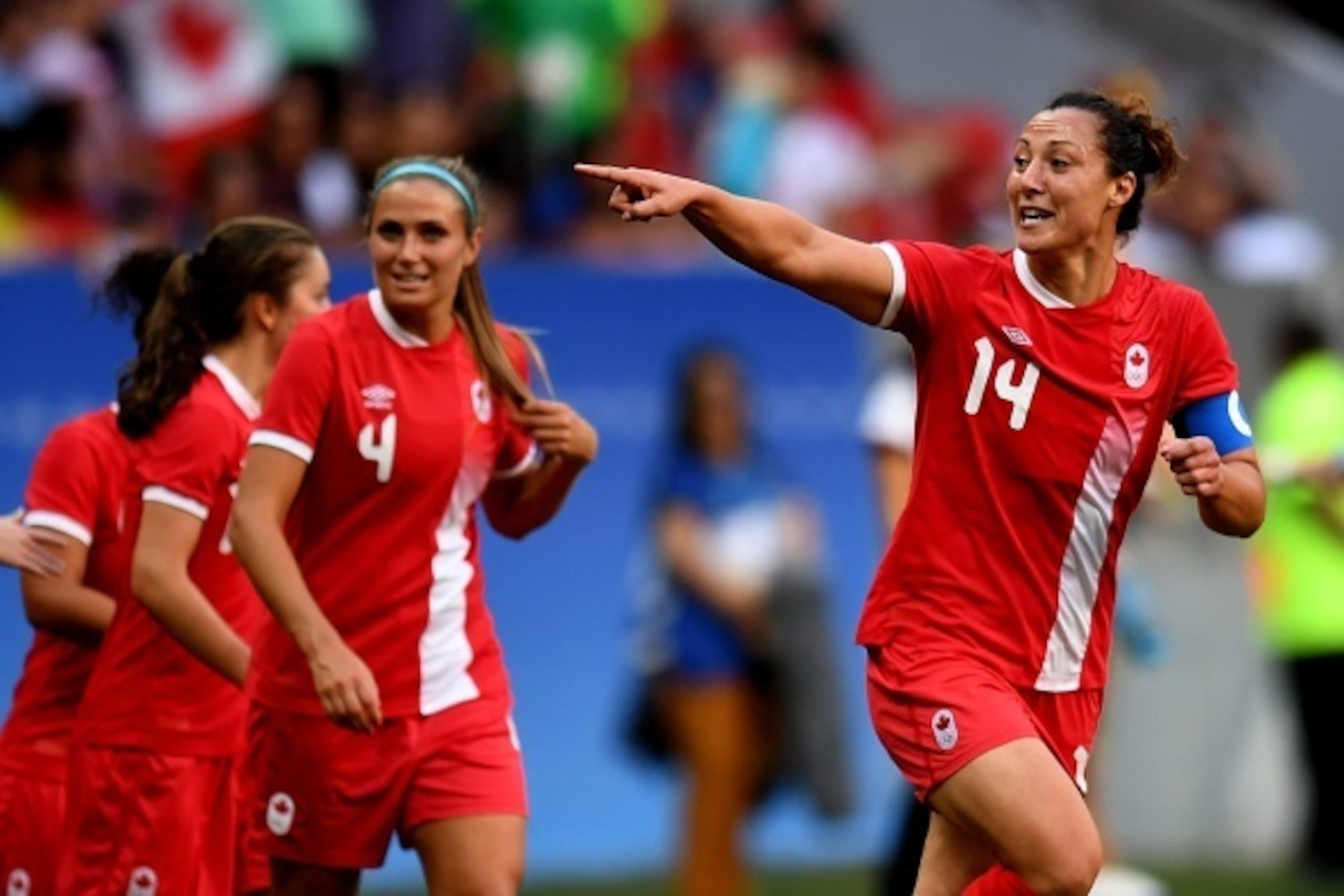 Canada player Melissa Tancredi celebrates after scoring during the Rio 2016 Olympic Games First Round Group F women's football match Germany vs Canada, at the Mane Garrincha Stadium in Brasilia on August 9, 2016. / AFP / EVARISTO SA        (Photo credit s