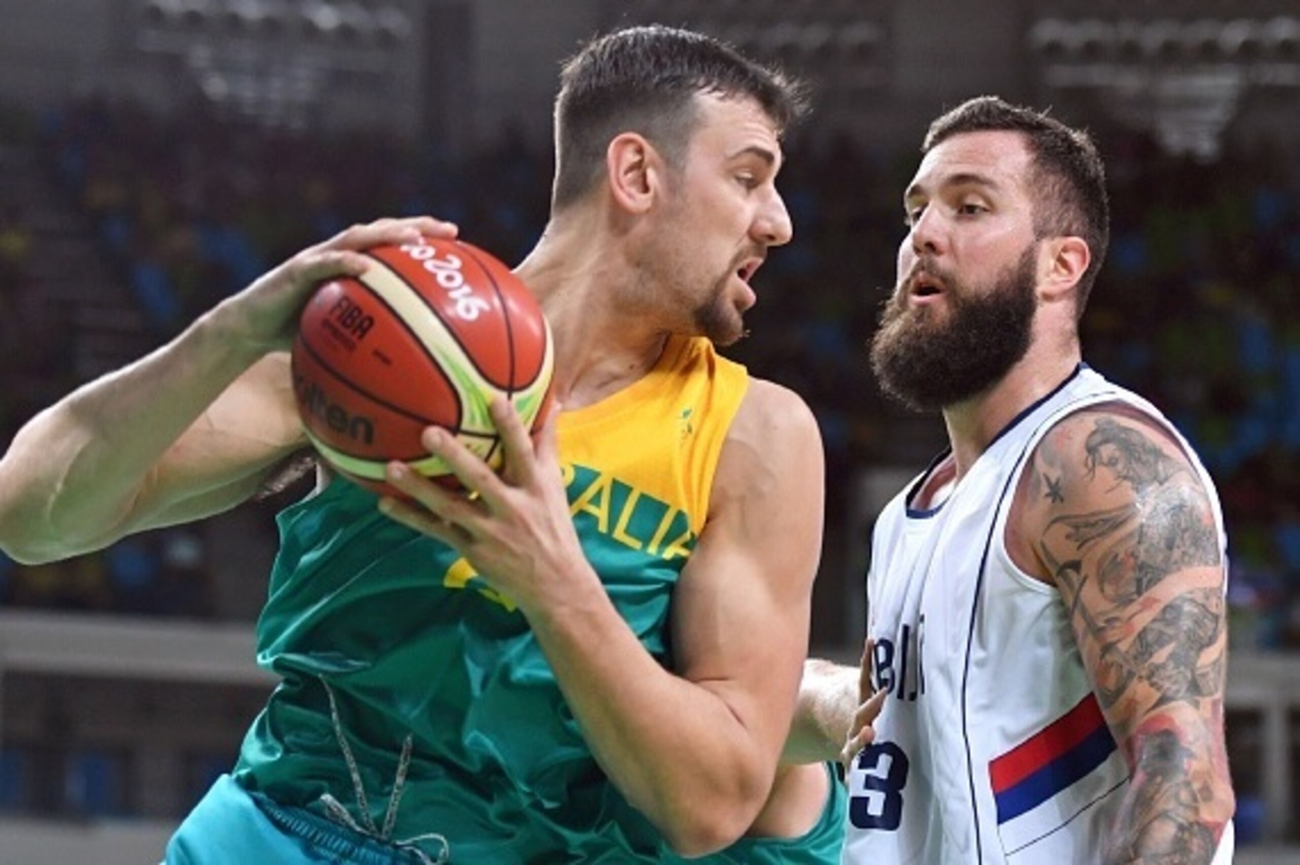 Australia's centre Andrew Bogut (L) holds on to the ball next to Serbia's centre Miroslav Raduljica during a Men's round Group A basketball match between Serbia and Australia at the Carioca Arena 1 in Rio de Janeiro on August 8, 2016 during the Rio 2016 O Australia's centre Andrew Bogut (L) holds on to the ball next to Serbia's centre Miroslav Raduljica during a Men's round Group A basketball match between Serbia and Australia at the Carioca Arena 1 in Rio de Janeiro on August 8, 2016 during the Rio 2016 O