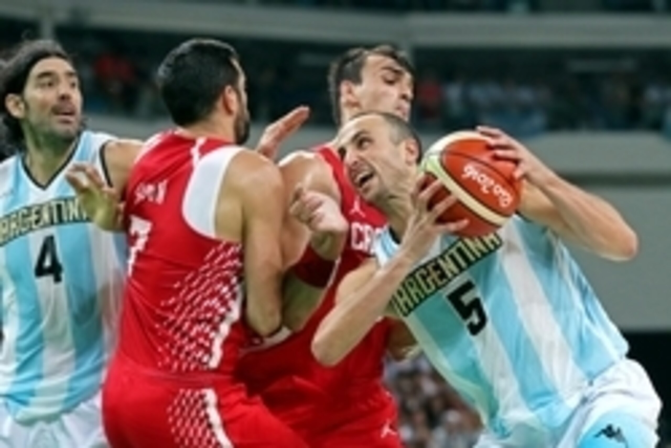 Aug 9, 2016; Rio de Janeiro, Brazil; Argentina shooting guard Manu Ginobili (5) drives to the basket against Croatia shooting guard Krunoslav Simon (7) during the men's basketball preliminary round in the Rio 2016 Summer Olympic Games at Carioca Arena 1. 