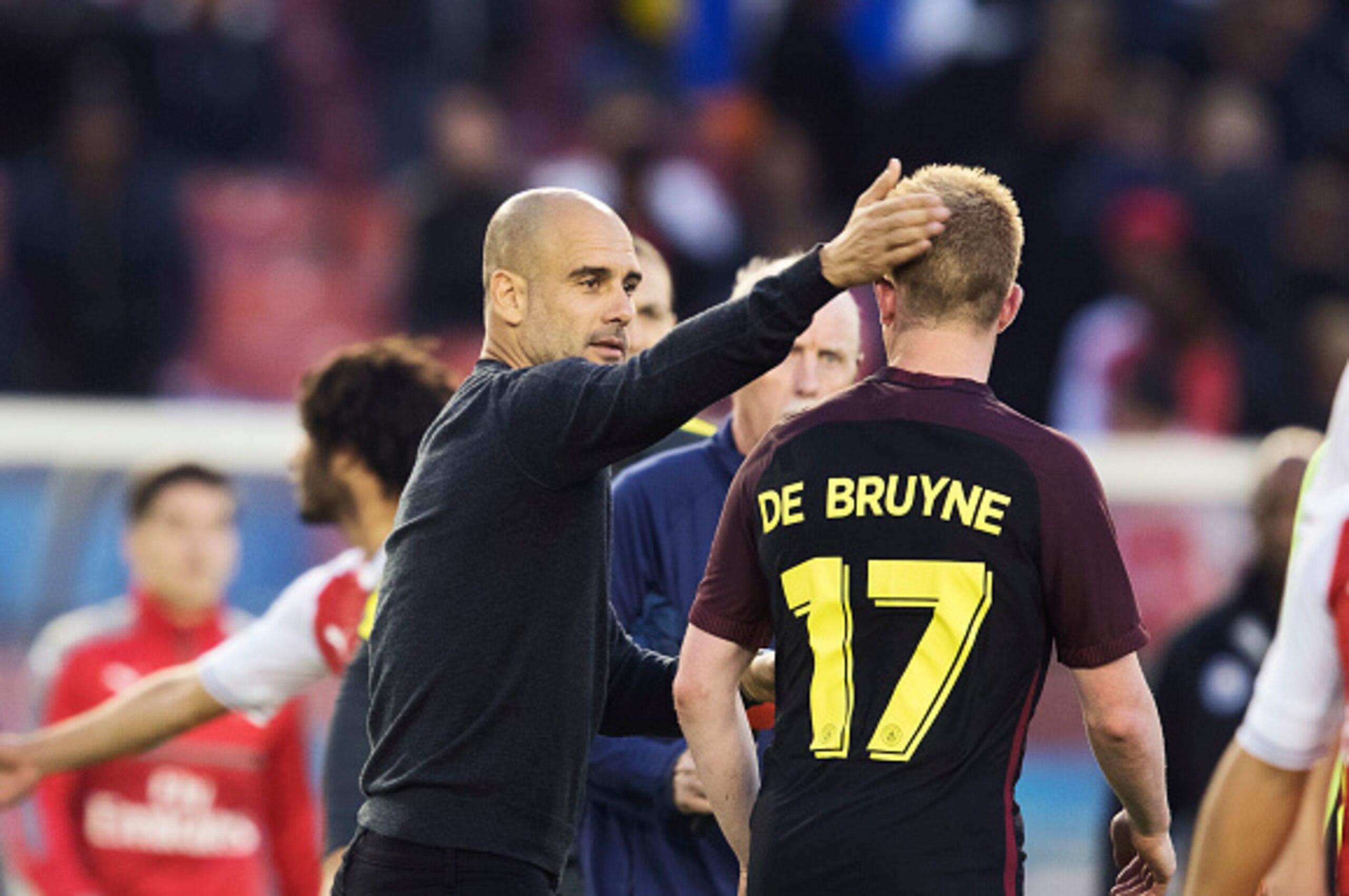 GOTHENBURG, SWEDEN - AUGUST 07: Pep Guardiola, head coach of Manchester City and Kevin de Bruyne of Manchester City during the Pre-Season Friendly between Arsenal and Manchester City at Ullevi on August 7, 2016 in Gothenburg, Sweden. (Photo by Nils Petter