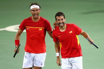 RIO DE JANEIRO, BRAZIL - AUGUST 09:  Rafael Nadal (L) and Marc Lopez of Spain celebrate defeating Oliver Marach and Alexander Peya of Austria in a Men's Doubles Quarterfinals match on Day 4 of the Rio 2016 Olympic Games at the Olympic Tennis Centre on Aug