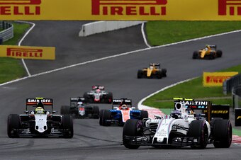 SPIELBERG, AUSTRIA - JULY 03: Valtteri Bottas of Finland driving the (77) Williams Martini Racing Williams FW38 Mercedes PU106C Hybrid turbo leads Sergio Perez of Mexico driving the (11) Sahara Force India F1 Team VJM09 Mercedes PU106C Hybrid turbo on tra
