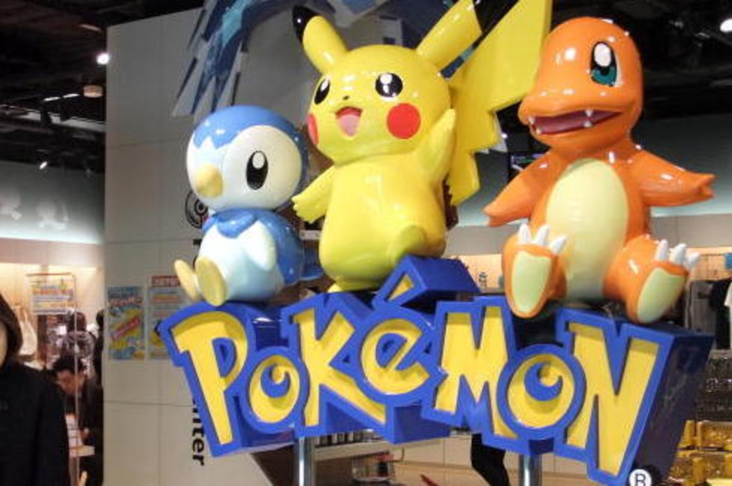 A woman walks past Pokemon game characters of Japanese video game manucacturer Nintendo displayed at a shop in Tokyo on January 28, 2010. Due to weak sales earlier in 2009, Nintendo's net profit fell 9.4 percent to 192.6 billion yen (2.1 billion USD) in t