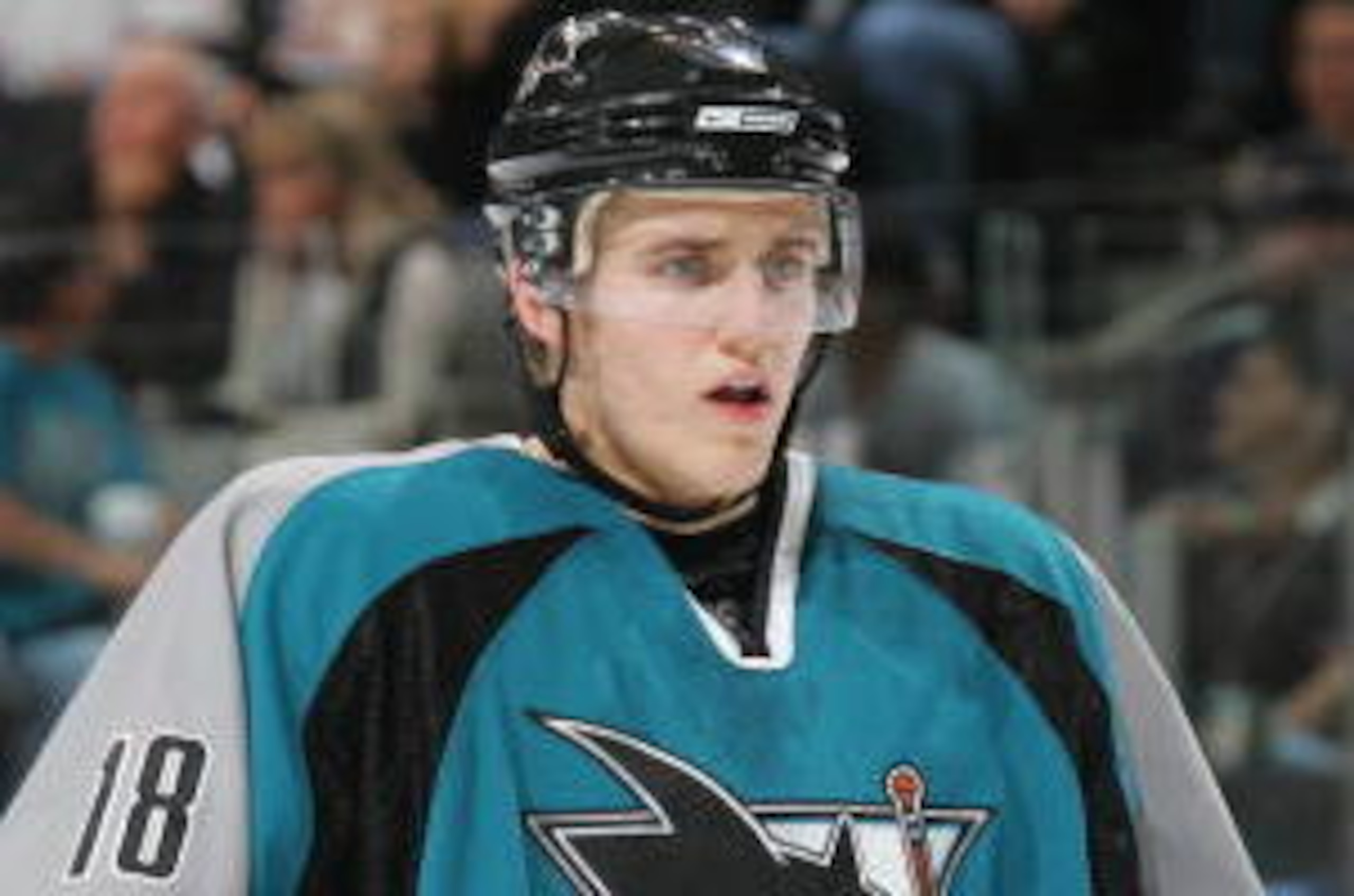 SAN JOSE, CA - OCTOBER 21: Matt Carle #18 of the San Jose Sharks looks on during a game against the Minnesota Wild on October 21, 2006 at the HP Pavilion in San Jose, California. The Wild won the game 3-1.  (Photo by Don Smith/Getty Images)