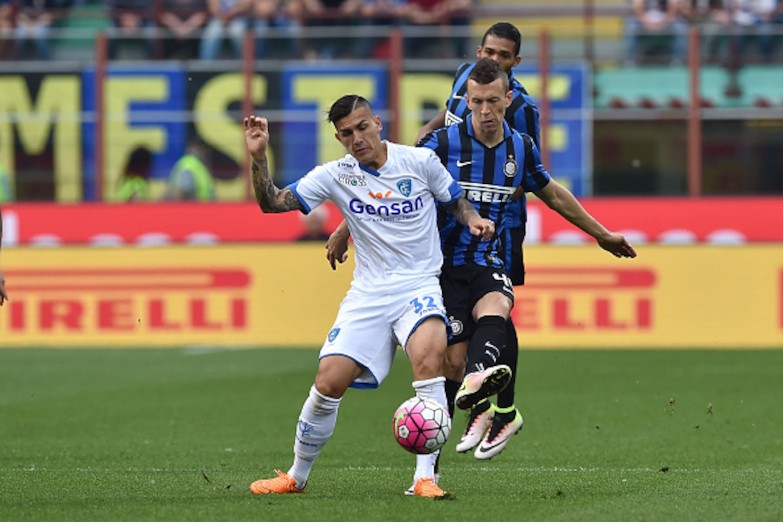 MILAN, ITALY - MAY 07:  Ivan Perisic (R) of FC Internazionale Milano competes with Leandro Paredes of Empoli FC during the Serie A match between FC Internazionale Milano and Empoli FC  at Stadio Giuseppe Meazza on May 7, 2016 in Milan, Italy.  (Photo by V