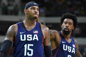 USA's forward Carmelo Anthony (L) celebrates after scoring a 3-pointer during a Men's round Group A basketball match between Australia and USA at the Carioca Arena 1 in Rio de Janeiro on August 10, 2016 during the Rio 2016 Olympic Games. / AFP / Mark RALS