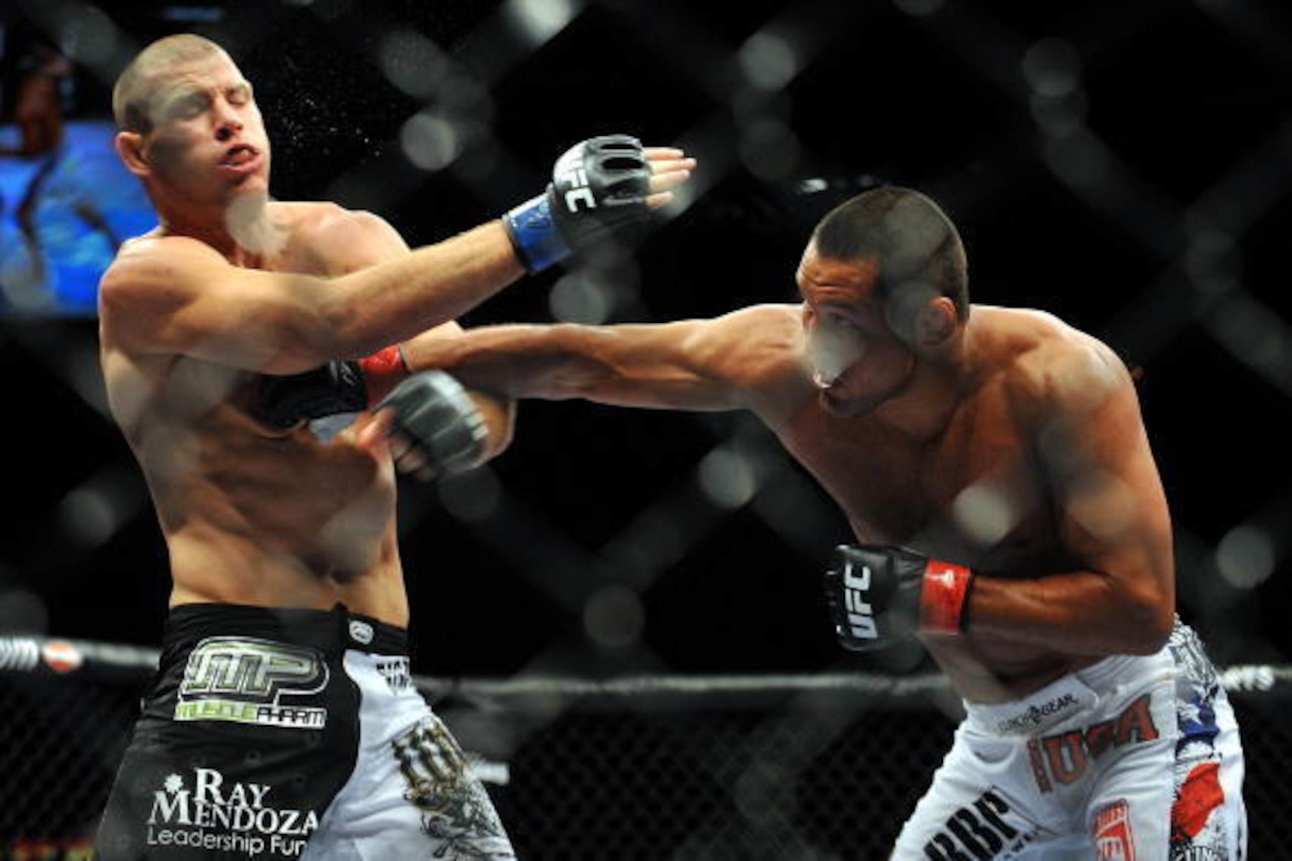LAS VEGAS - JULY 11:  (R-L) Dan Henderson connects with a right to Mike Bisping during their middleweight bout during UFC 100 on July 11, 2009 in Las Vegas, Nevada.  (Photo by Jon Kopaloff/Getty Images)