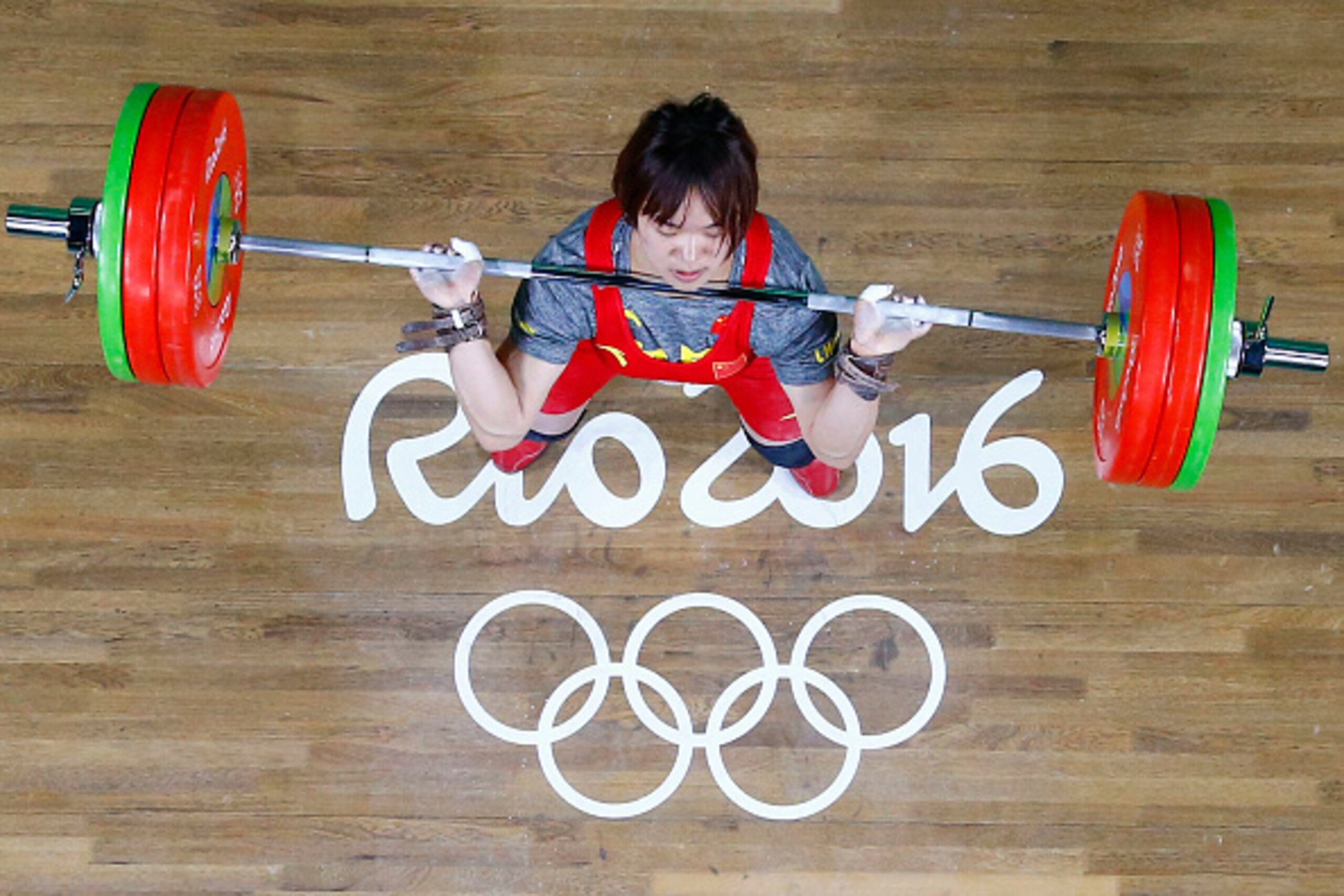 China's Xiang Yanmei competes during the Women's 69kg weightlifting competition at the Rio 2016 Olympic Games in Rio de Janeiro on August 10, 2016.  / AFP / POOL / Stoyan Nenov        (Photo credit should read STOYAN NENOV/AFP/Getty Images)