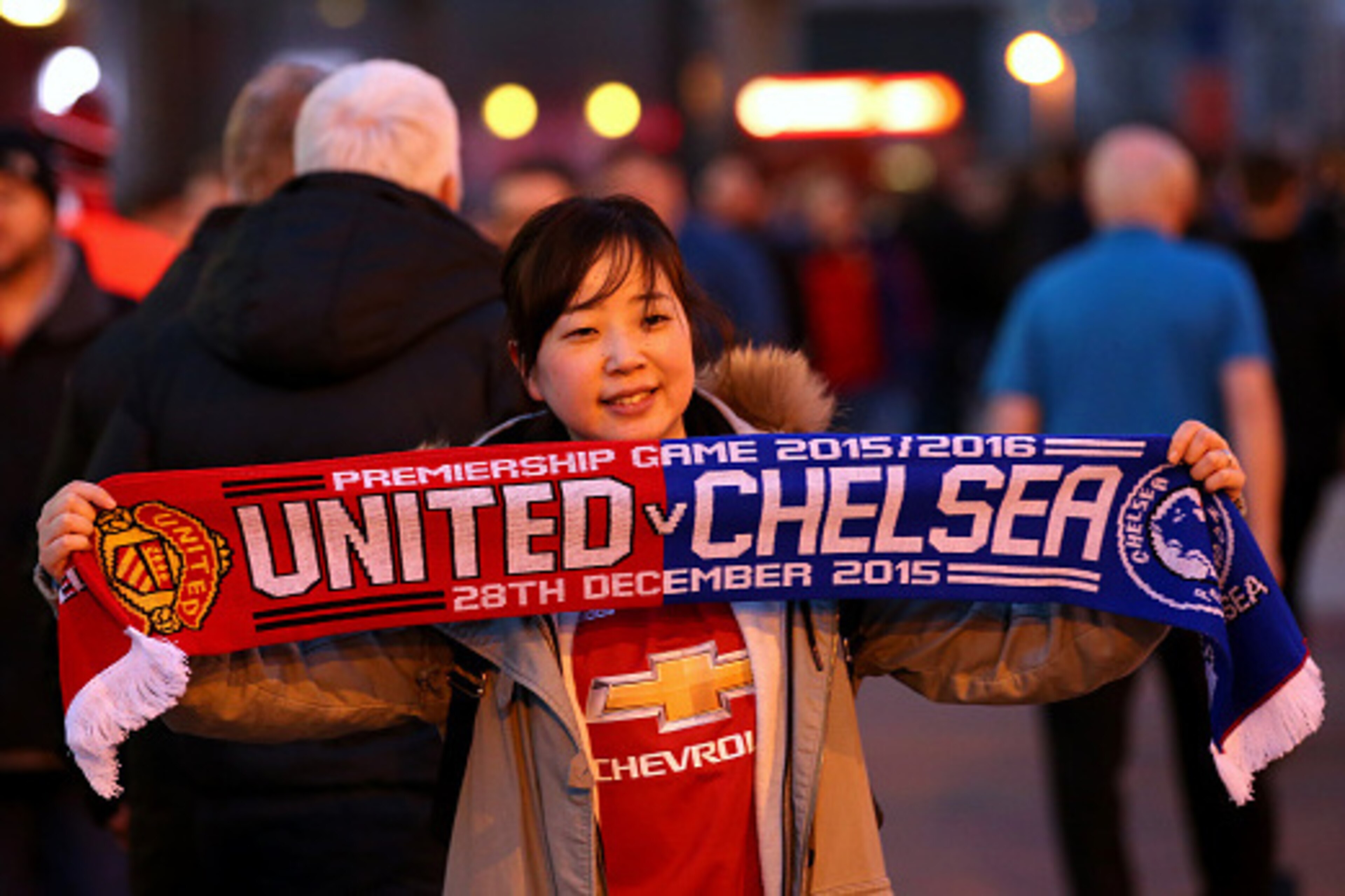 MANCHESTER, ENGLAND - DECEMBER 28:  A Manchester United fan poses with a scarf outside the stadium before the Barclays Premier League match between Manchester United and Chelsea at Old Trafford on December 28, 2015 in Manchester, England.  (Photo by Alex 