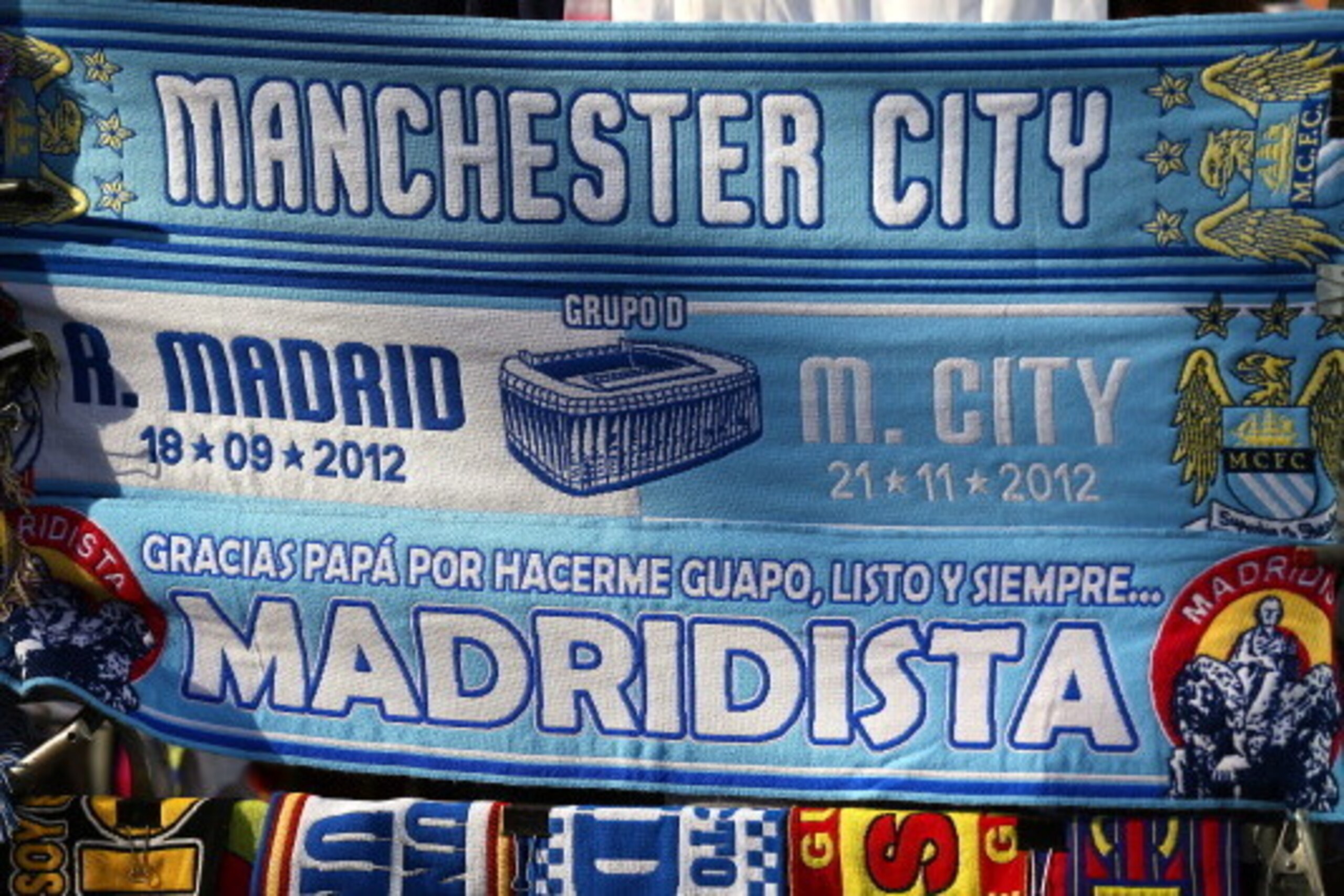 MADRID, SPAIN - SEPTEMBER 18:  Scarves of Real Madrid and Manchester City FC are seen on sale prior to the UEFA Champions League Group D match between Real Madrid and Manchester City FC at Estadio Santiago Bernabeu on September 18, 2012 in Madrid, Spain. 