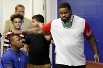 Aug 10, 2016; Arlington, TX, USA; Texas Ranger designated hitter Prince Fielder (left) pats the head of teammate Adrian Beltre (right) as he enters a press conference to announce the end of his 12-year playing career after his second neck surgery in 27 mo