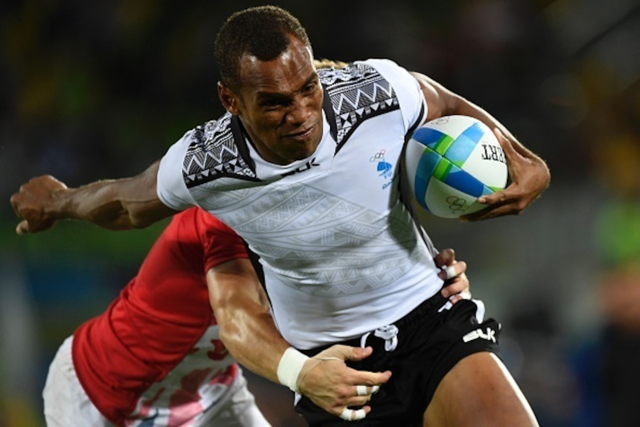 Fiji's Osea Kolinisau scores a try in the mens rugby sevens gold medal match between Fiji and Britain during the Rio 2016 Olympic Games at Deodoro Stadium in Rio de Janeiro on August 11, 2016. / AFP / John MACDOUGALL (Photo credit should read JOHN Fiji's Osea Kolinisau scores a try in the mens rugby sevens gold medal match between Fiji and Britain during the Rio 2016 Olympic Games at Deodoro Stadium in Rio de Janeiro on August 11, 2016. / AFP / John MACDOUGALL (Photo credit should read JOHN
