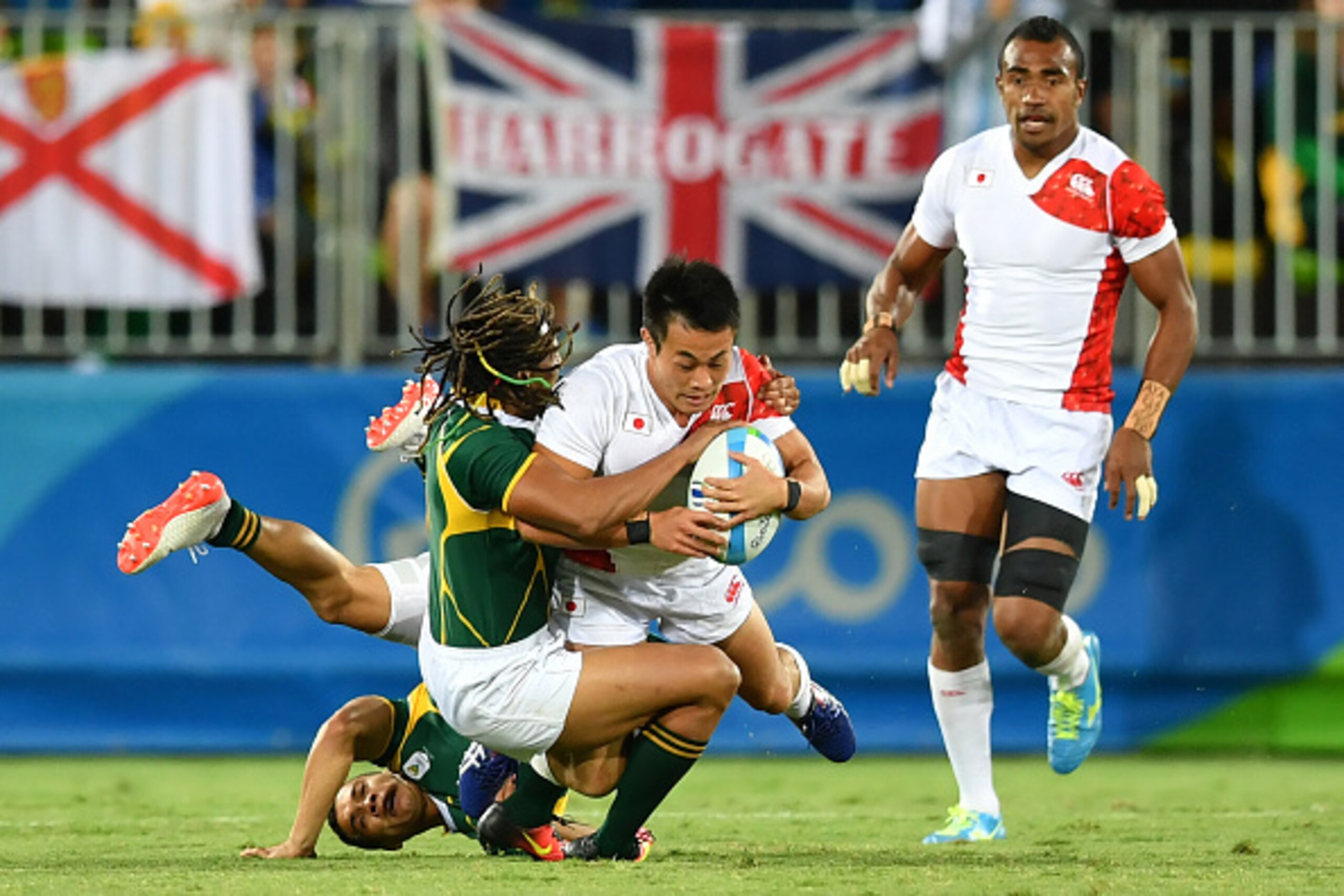 Japan's Kenki Fukuoka is tackled in the mens rugby sevens bronze medal match between Japan and South Africa during the Rio 2016 Olympic Games at Deodoro Stadium in Rio de Janeiro on August 11, 2016. / AFP / Pascal GUYOT (Photo credit should read PA Japan's Kenki Fukuoka is tackled in the mens rugby sevens bronze medal match between Japan and South Africa during the Rio 2016 Olympic Games at Deodoro Stadium in Rio de Janeiro on August 11, 2016. / AFP / Pascal GUYOT (Photo credit should read PA