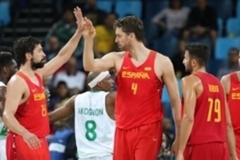 Aug 11, 2016; Rio de Janeiro, Brazil; Spain center Pau Gasol (4) celebrates with point guard Sergio Llull (23) during the men's preliminary round against Nigeria in the Rio 2016 Summer Olympic Games at Carioca Arena 1.  Mandatory Credit: Jeff Swinger-USA 