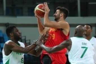 Aug 11, 2016; Rio de Janeiro, Brazil; Spain guard Ricky Rubio (79) is defended by Nigeria guard Chamberlain Oguchi (9) and forward Al-Farouq Aminu (7) during the men's preliminary round in the Rio 2016 Summer Olympic Games at Carioca Arena 1. Mandatory Cr