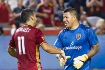 Aug 6, 2016; Sandy, UT, USA; Real Salt Lake midfielder Javier Morales (11) congratulates goalkeeper Nick Rimando (18) following their 3-1 victory over the Chicago Fire at Rio Tinto Stadium. Rimando became the career leader in all-time wins for an MLS goal