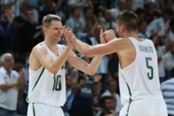 Aug 11, 2016; Rio de Janeiro, Brazil;  Lithuania shooting guard Renaldas Seibutis (10) and guard Mantas Kalnietis (5)  celebrate during the men's preliminary round against Argentina in the Rio 2016 Summer Olympic Games at Carioca Arena 1.  Mandatory Credi