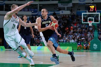 RIO DE JANEIRO, BRAZIL - AUGUST 11:  Manu Ginobili #5 of Argentina drives to the basket against Domantas Sabonis #11 of Lithuania during the Men's Basketball - Preliminary Round Group B Lithuania vs Argentina on Day 6 of the Rio 2016 Olympic Games at Cari