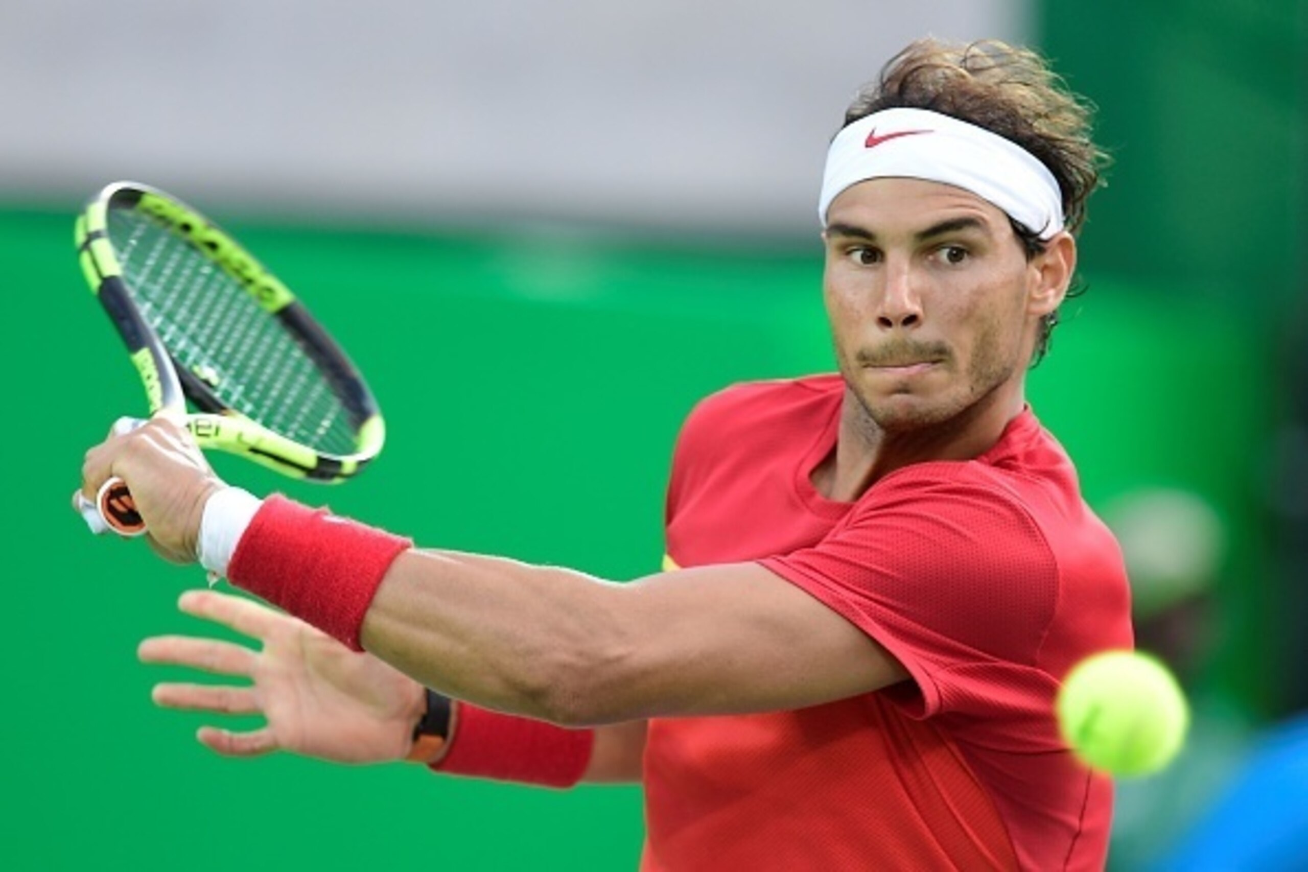 Spain's Rafael Nadal returns the ball to Brazil's Thomaz Bellucci during their men's singles quarter-finals tennis match at the Olympic Tennis Centre of the Rio 2016 Olympic Games in Rio de Janeiro on August 12, 2016. / AFP / JAVIER SORIANO (Photo Spain's Rafael Nadal returns the ball to Brazil's Thomaz Bellucci during their men's singles quarter-finals tennis match at the Olympic Tennis Centre of the Rio 2016 Olympic Games in Rio de Janeiro on August 12, 2016. / AFP / JAVIER SORIANO (Photo