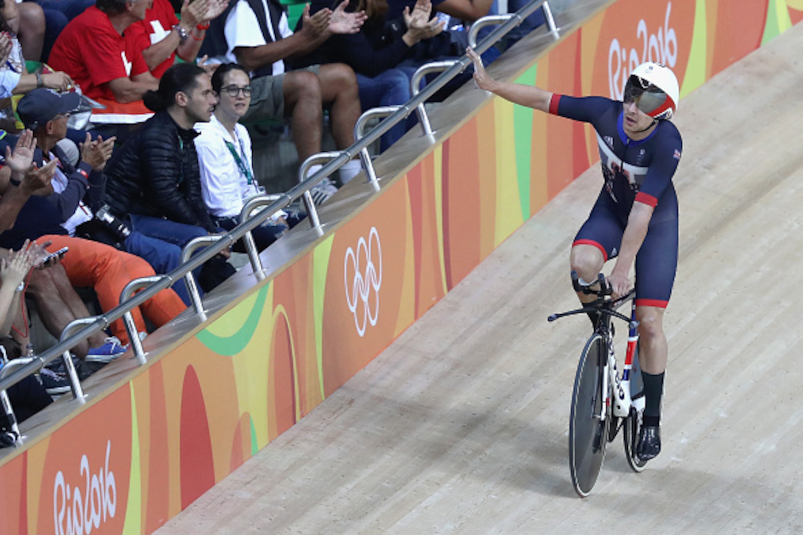 RIO DE JANEIRO, BRAZIL - AUGUST 12:  Edward Clancy, Steven Burke, Owain Doull and Bradley Wiggins of Team Great Britain celebrates setting the new world record of 3:50.570 after competing in the Men's Team Pursuit First Round on Day 7 of the Rio 2016 Olym