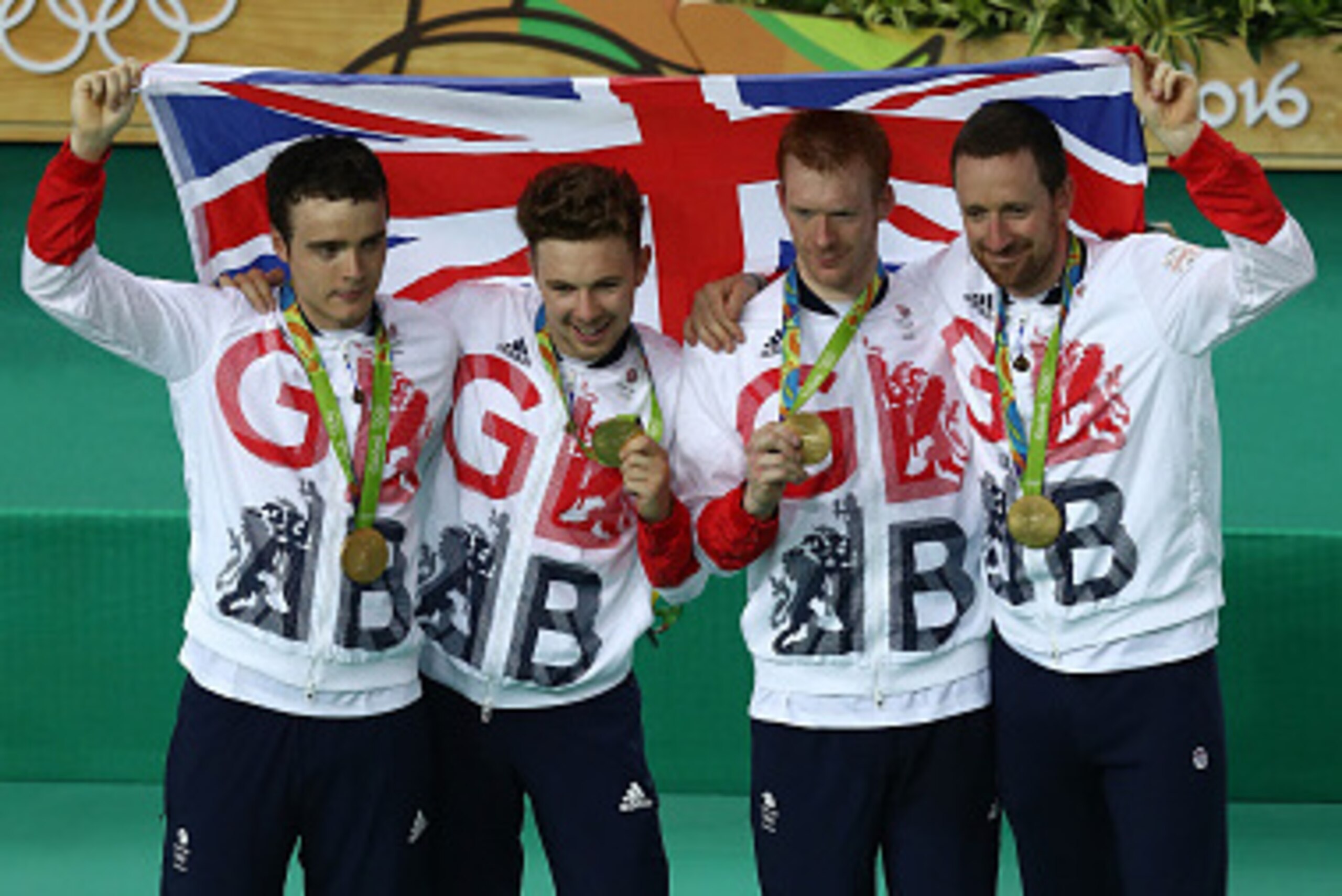 RIO DE JANEIRO, BRAZIL - AUGUST 12:  Gold medalists  Steven Burke, Owain Doull, Edward Clancy and Bradley Wiggins of Team Great Britain pose for photographs after the medal ceremony for the Men's Team Pursuit on Day 7 of the Rio 2016 Olympic Games at the 