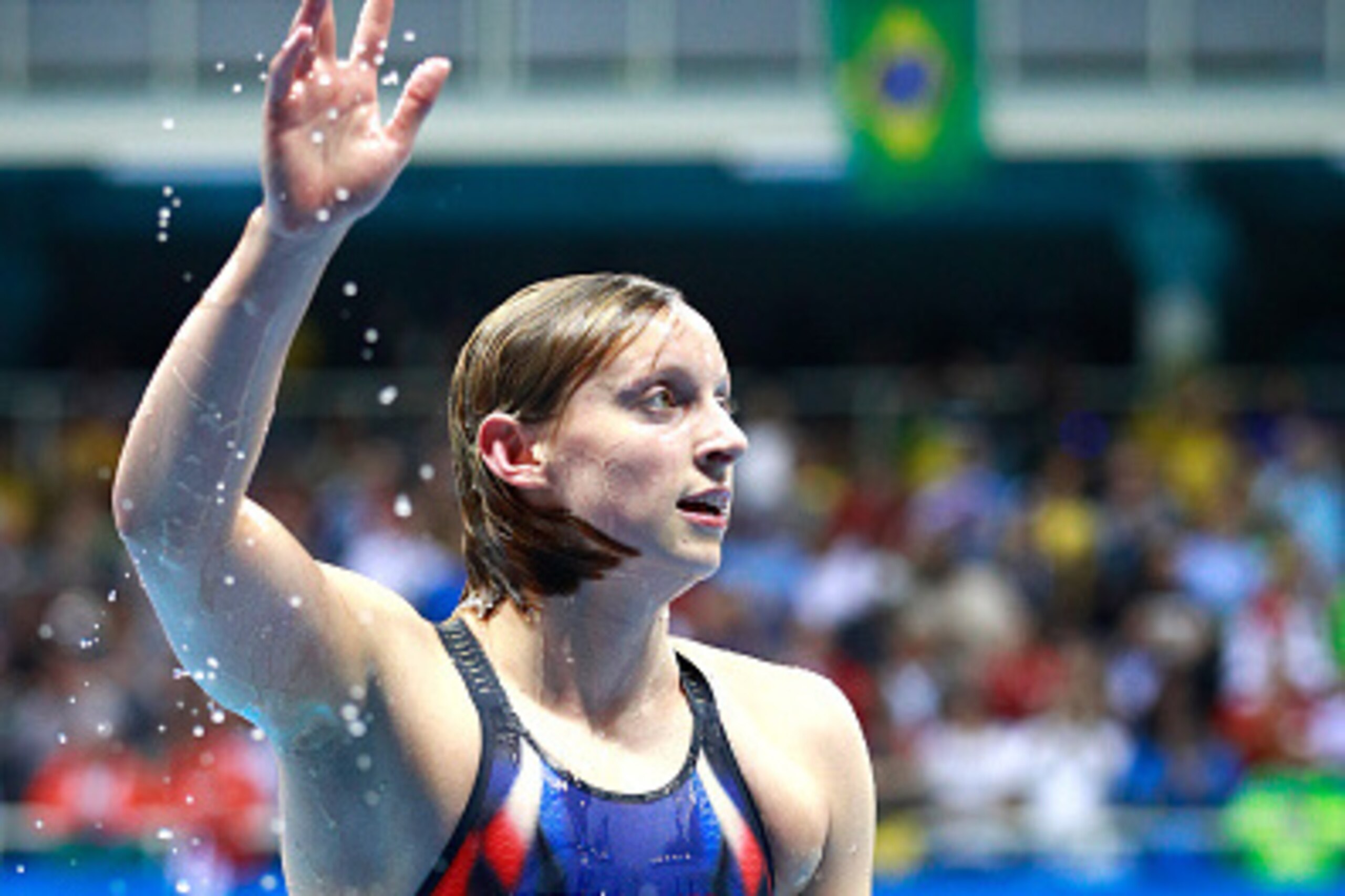 RIO DE JANEIRO, BRAZIL - AUGUST 12: Katie Ledecky of the United States celebrates winning gold and setting a new world record in the time of 8:04.79sec in the Women's 800m Freestyle Final on Day 7 of the Rio 2016 Olympic Games at the Olympic Aquatics Sta RIO DE JANEIRO, BRAZIL - AUGUST 12: Katie Ledecky of the United States celebrates winning gold and setting a new world record in the time of 8:04.79sec in the Women's 800m Freestyle Final on Day 7 of the Rio 2016 Olympic Games at the Olympic Aquatics Sta