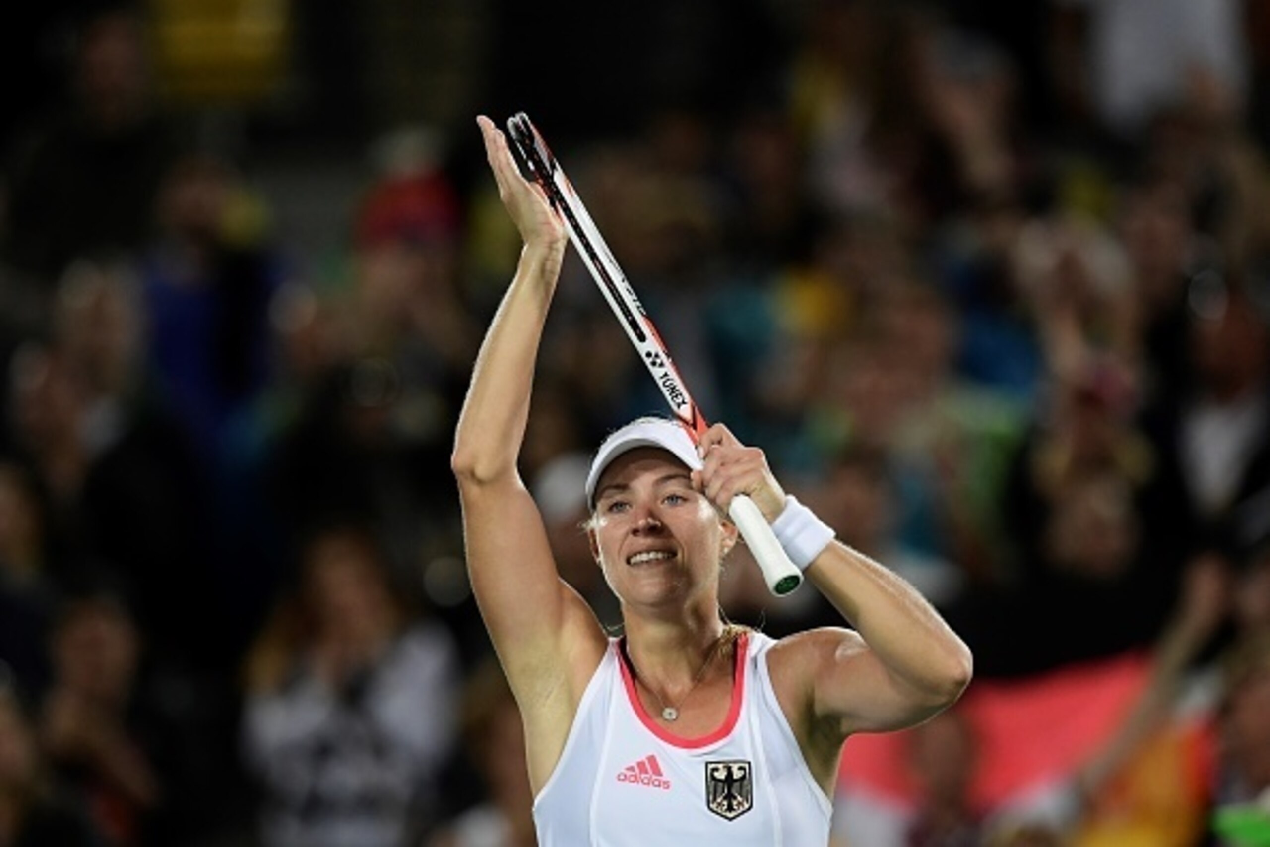 Germany's Angelique Kerber celebrates after winning her women's singles semi-finals tennis match against US player Madison Keys at the Olympic Tennis Centre of the Rio 2016 Olympic Games in Rio de Janeiro on August 12, 2016. / AFP / JAVIER SORIANO        